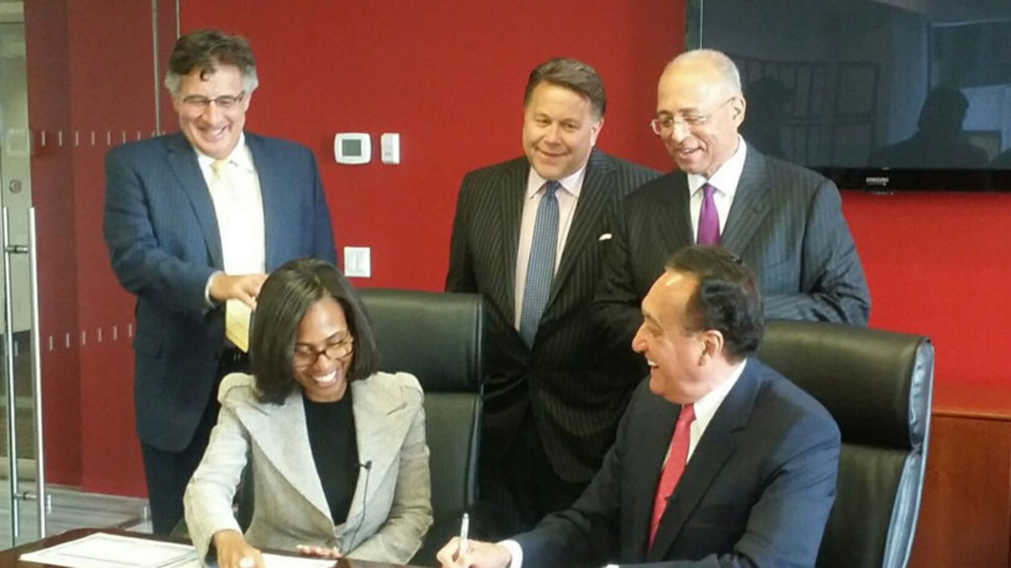 Suzanne Shank and Henry Cisneros, seated left and right. AJC file