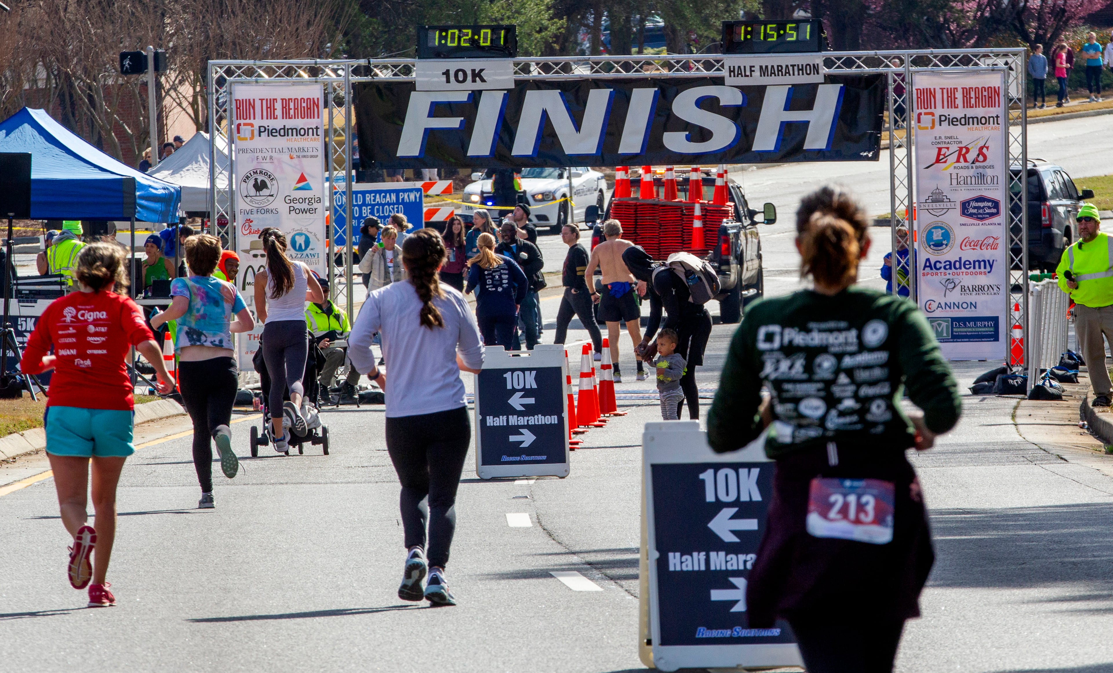 10K runners head for the finish line during the Run the Reagan race on Ronald Reagan Parkway in Gwinnett County on Saturday, February 26, 2022. (Photo: Steve Schaefer for The Atlanta Journal-Constitution)