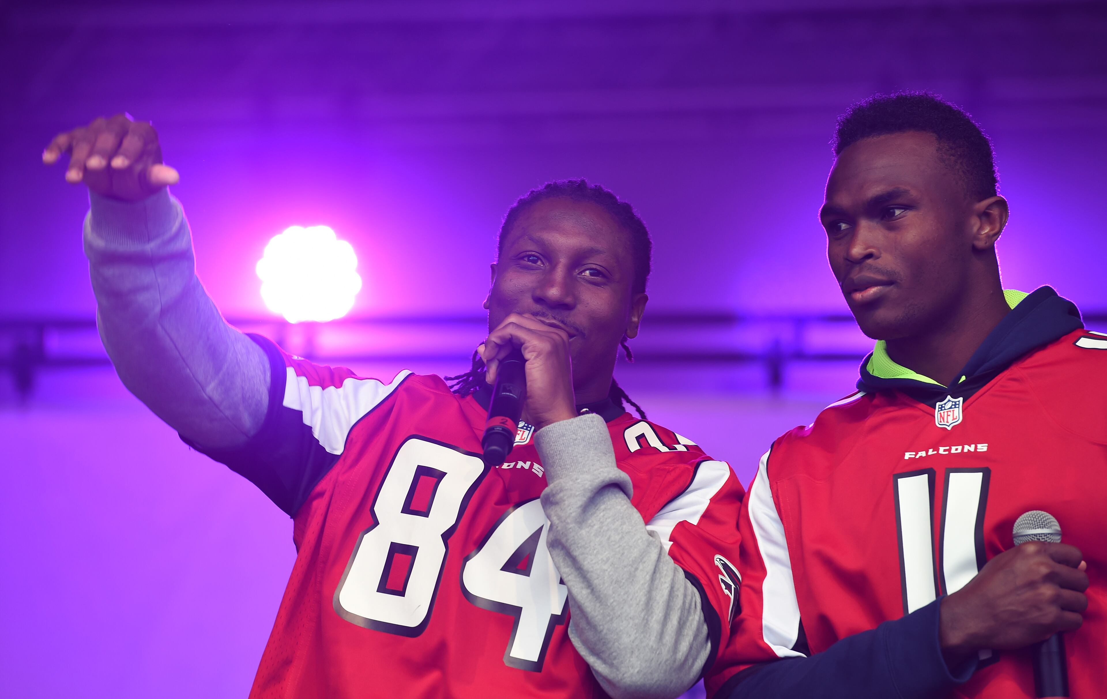 Atlanta Falcons wide receivers Roddy White, left, and Julio Jones speak on stage during the NFL Fan Rally in Trafalgar Square, London, England, Saturday, Oct. 25, 2014. The Atlanta Falcons will play the Detroit Lions in an NFL football game at London's Wembley Stadium on Sunday Oct. 26. (AP Photo/Tim Ireland)