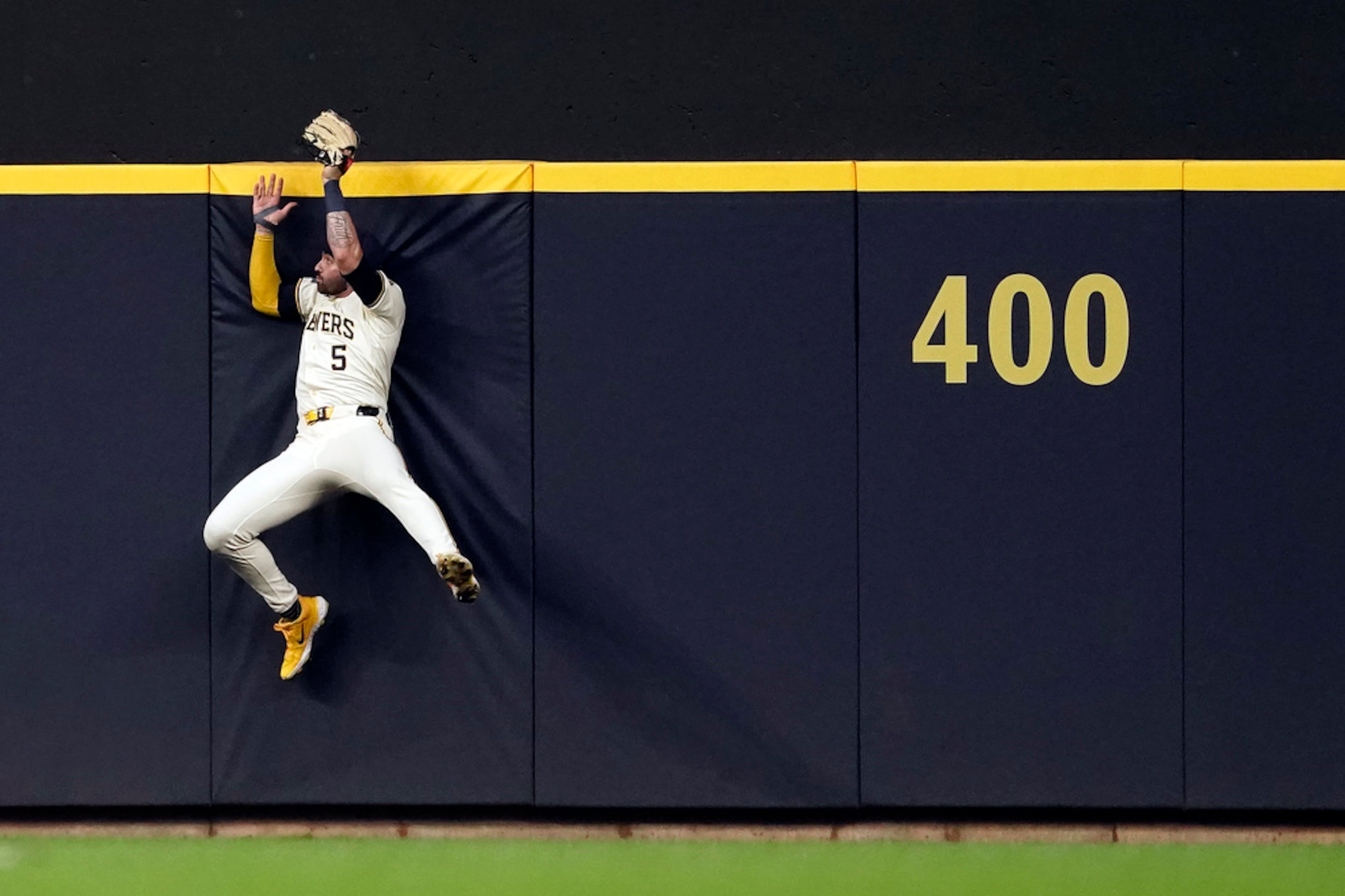 Milwaukee Brewers' Garrett Mitchell makes a leaping catch at the wall during the fourth inning of a baseball game against the Atlanta Braves, Monday, July 29, 2024, in Milwaukee. (AP Photo/Aaron Gash)