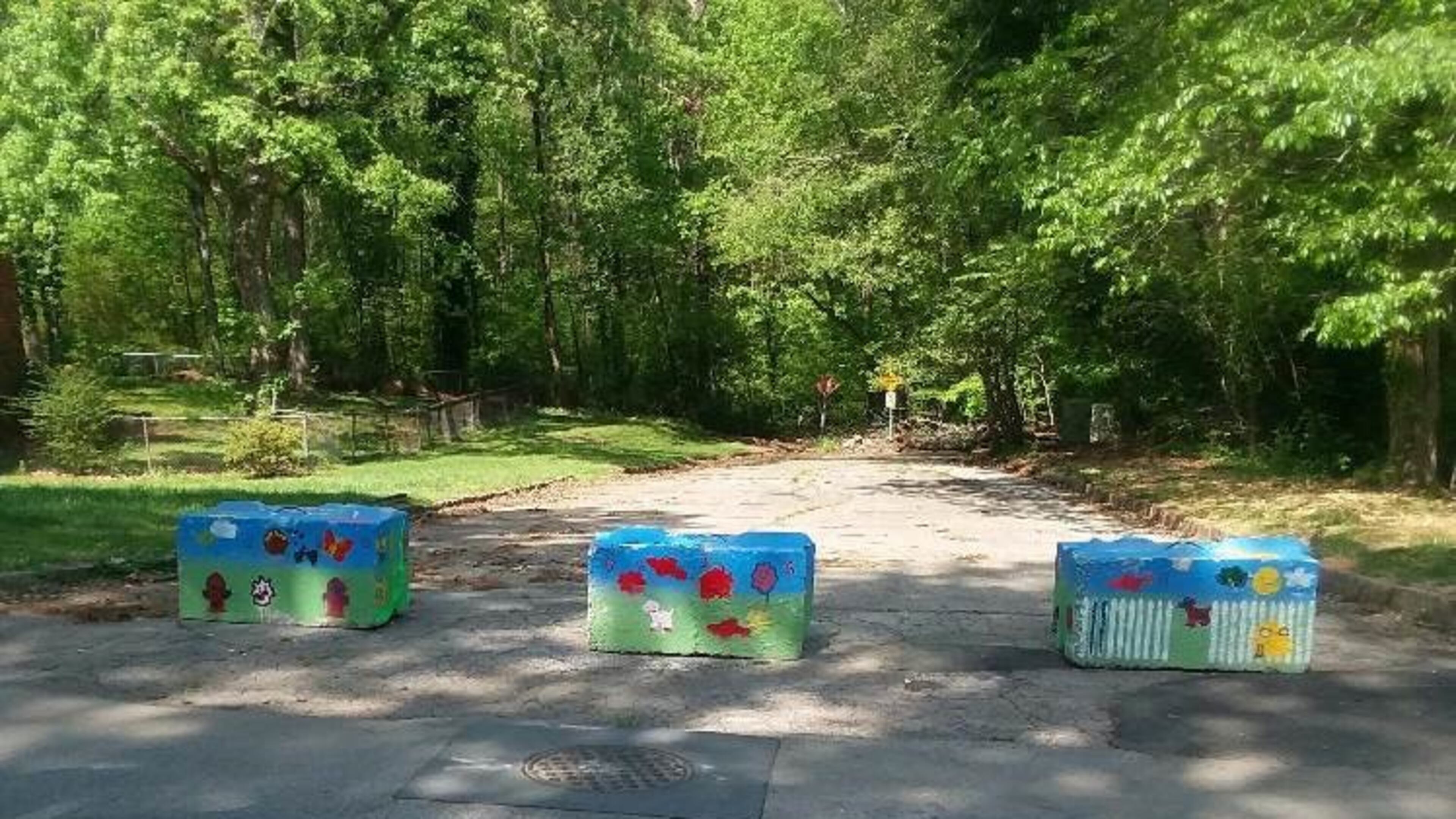 Colorful barriers off River Road in south DeKalb County block a former illegal dump site. Photo: DeKalb County
