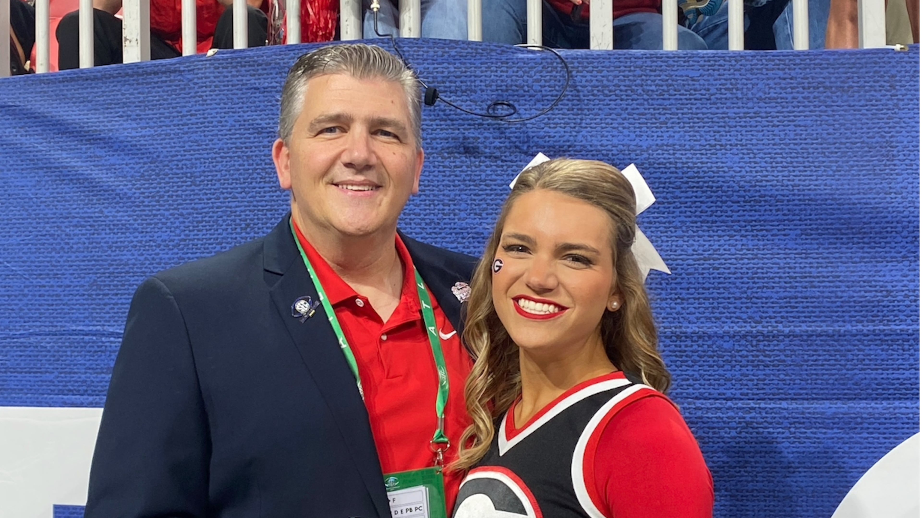David Epps (left) — pictured with his daughter, Maggie, when she was a cheerleader for Georgia — will take over as CEO of the Peach Bowl after the retirement of Gary Stokan. (Courtesy)