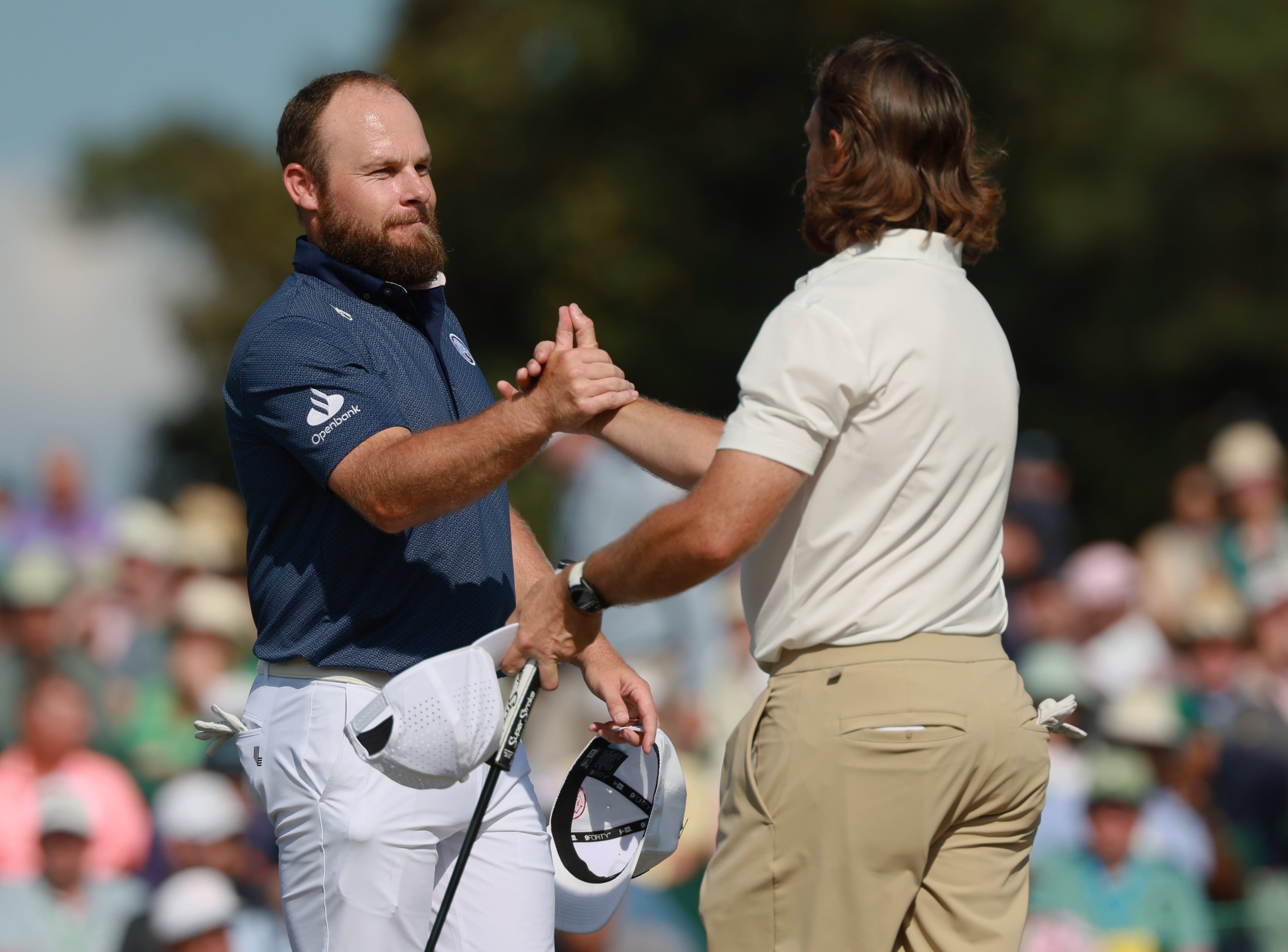 Tyrrell Hatton greets Tommy Fleetwood at end of final round of the Masters, at Augusta National Golf Club, Sunday, April 12, 2026, in Augusta, GA (Jason Getz/AJC)