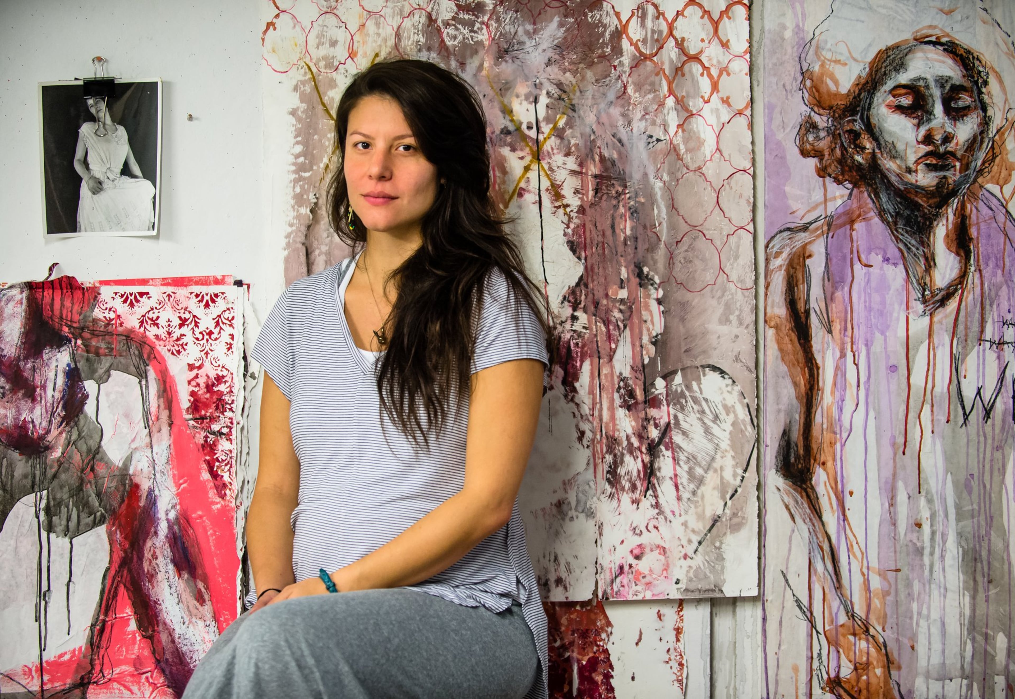 Jessica Caldas sits in her studio at Georgia State University, surrounded by her work inspired by (from bottom right) her experience and recovery from sexual assault, the general experience of growing up as a woman, and domestic violence, Wednesday, Oct. 25, 2017. Jessica posted #MeToo but had mixed feelings about it. She is a local artist and rape victim. She said it's important to raise awareness to the problem of sexual harassment and sexual assault, but said she would really like to see actions being taken to lead to real change. BITA HONARVAR/SPECIAL
