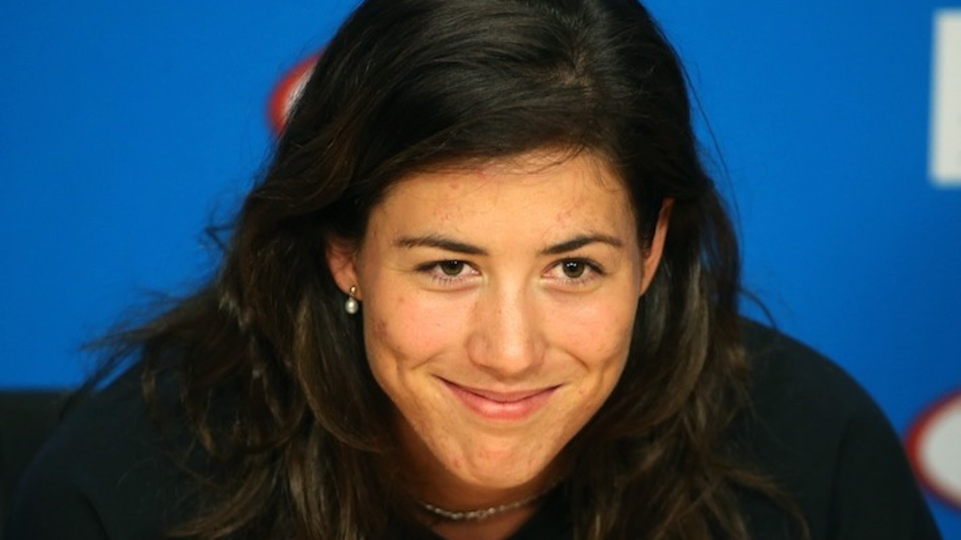 Garbine Muguruza of Spain smiles during a press conference, ahead of the Australian Open tennis championships in Melbourne, Australia, Saturday, Jan. 16, 2016.(AP Photo/Rick Rycroft)