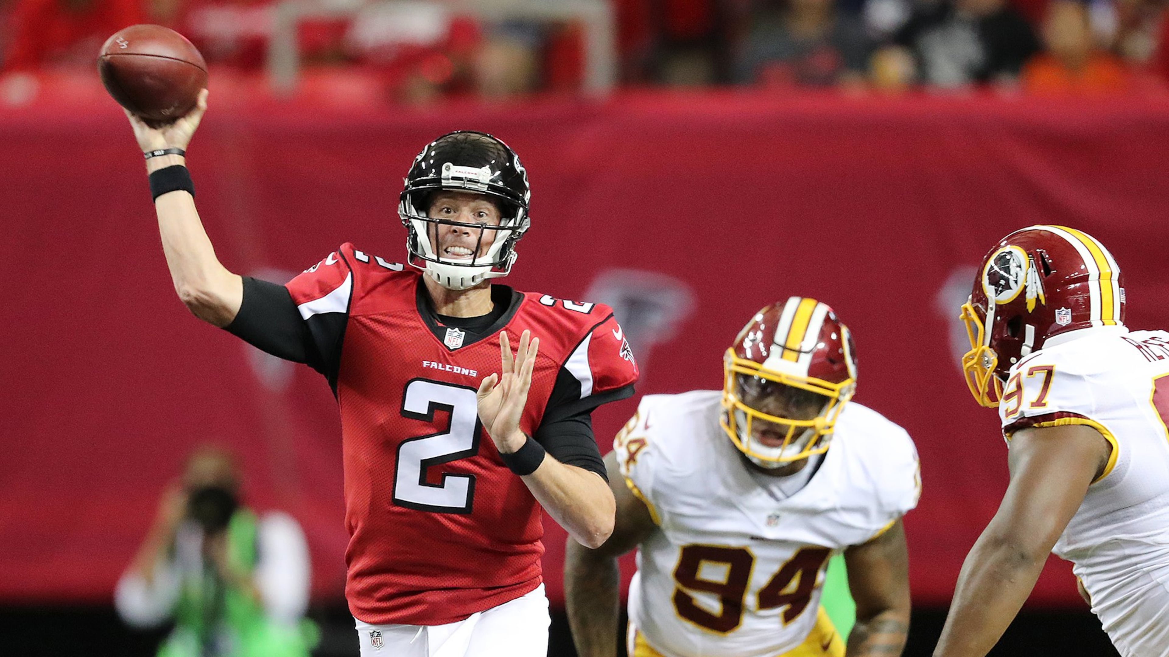 081116 ATLANTA: Falcons quarterback Matt Ryan throws an incomplete pass under pressure from Redskins linebacker Preston Smith to go three and out during the first quarter in an NFL preseason football game on Thursday, August 11, 2016, in Atlanta. Curtis Compton /ccompton@ajc.com
