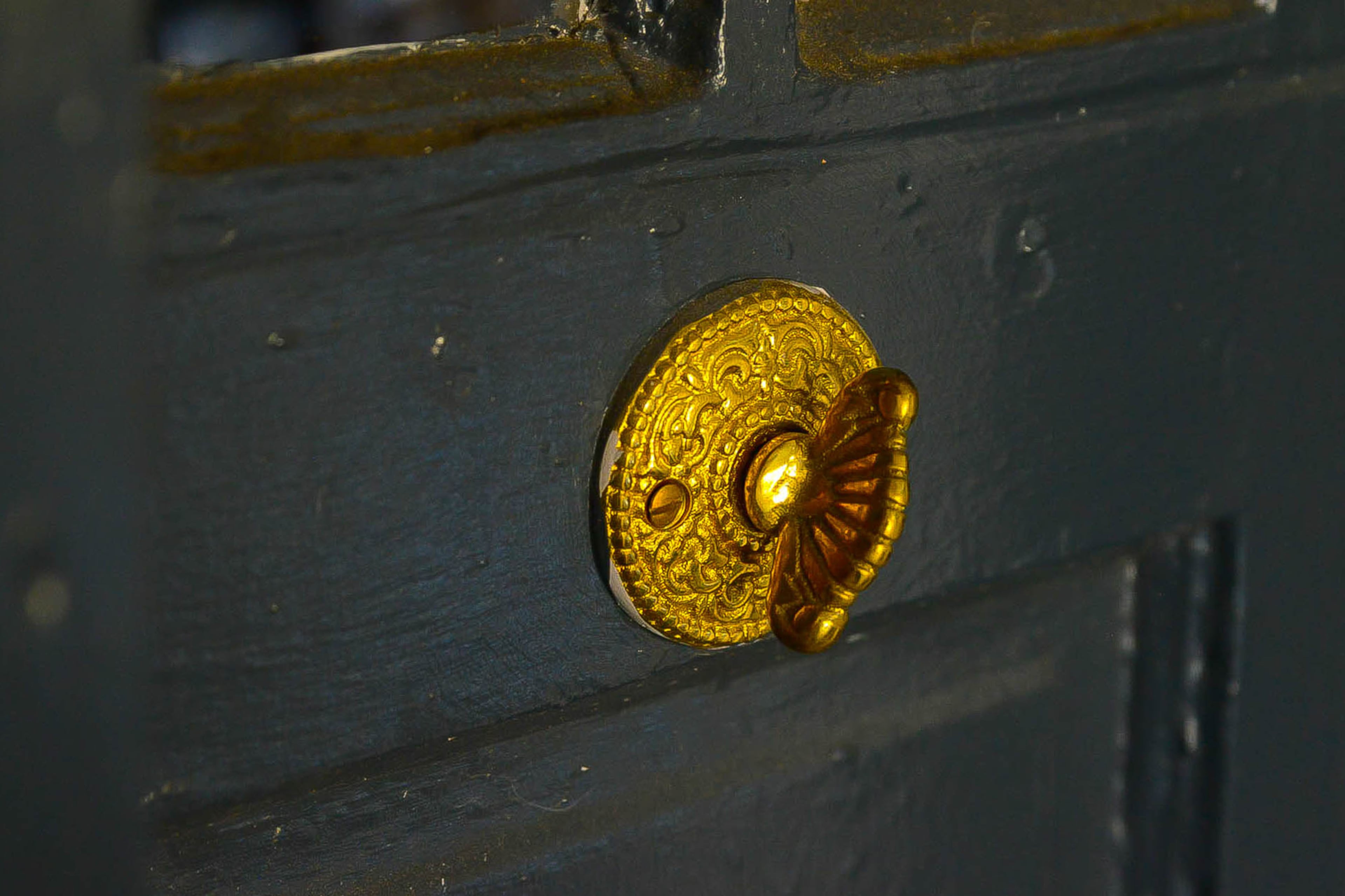 The brass doorbell is original to the 1920s home. It works, by cranking, instead of ringing, it. Text by Lori Johnston/Fast Copy News Service.