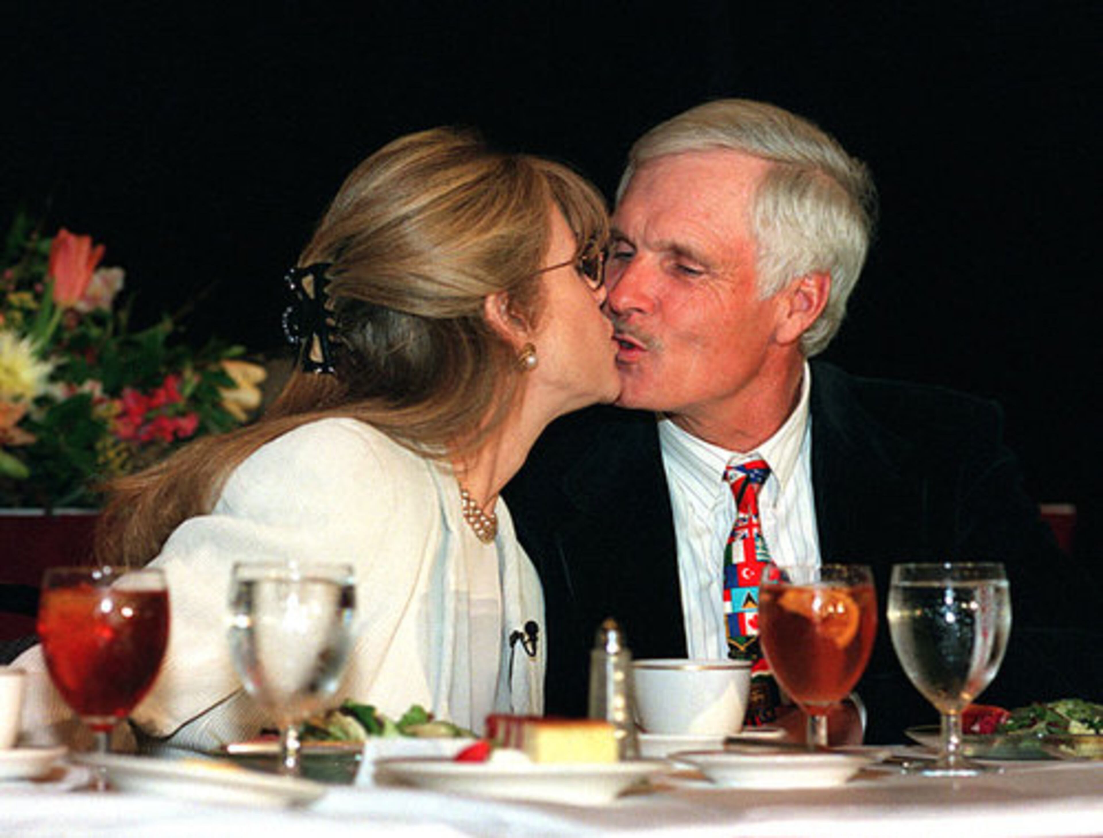 Fonda and husband Ted Turner kiss during a G-CAPP luncheon in 1999 at the Omni Hotel. The two would divorce two years later.