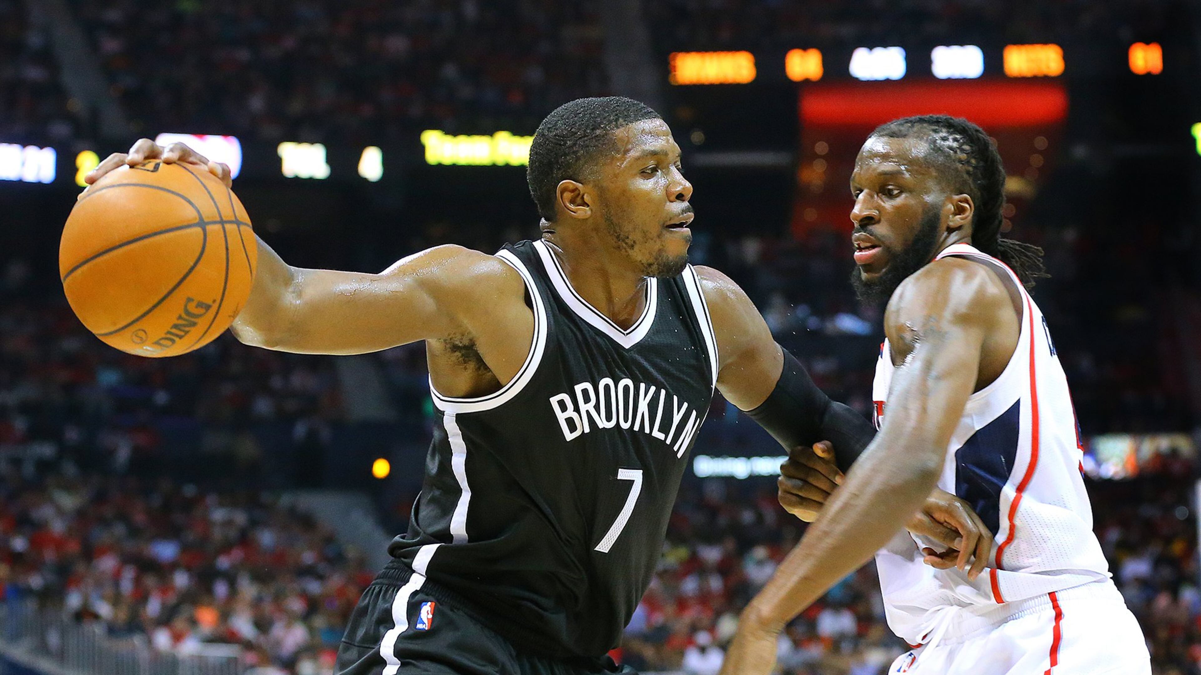 Nets guard Joe Johnson drives against Hawks defender DeMarre Carroll in their first round game two playoff basketball game at Philips Arena on Wednesday, April 22, 2015, in Atlanta. Curtis Compton / ccompton@ajc.com