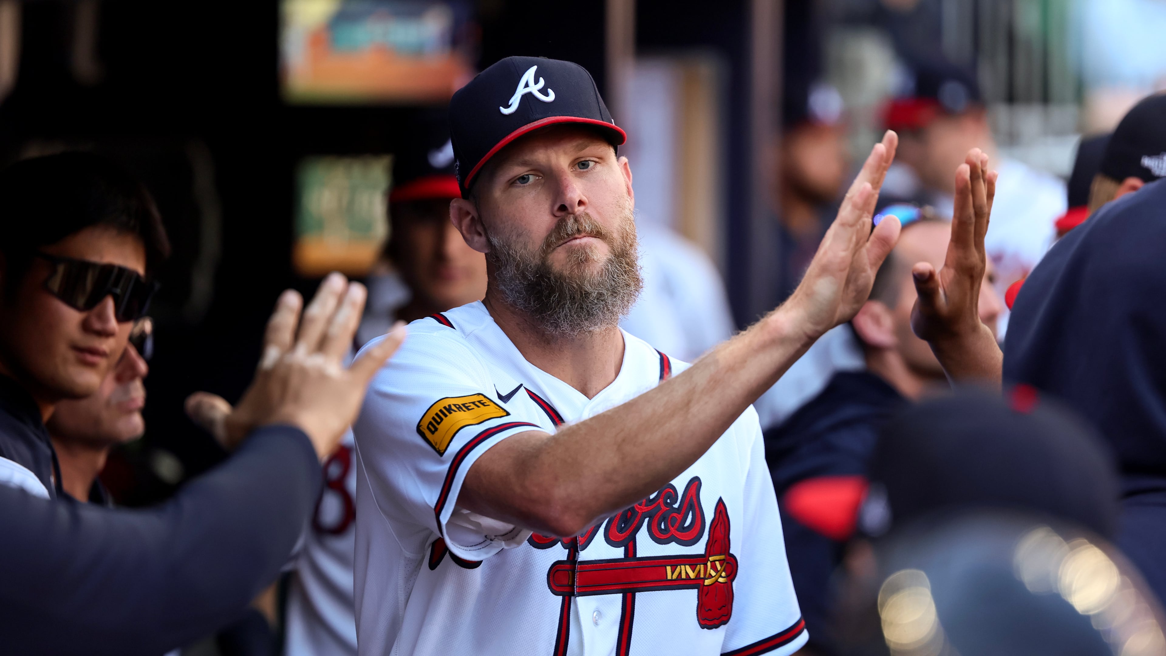 Atlanta Braves pitcher Chris Sale is greeted in the dugout after being relieved during the seventh inning of Game 1 of a MLB National League Wild Card playoff series between the Atlanta Braves and the Philadelphia Phillies, Tuesday, Sept. 29, 2026, in Atlanta. (Jason Getz/AJC)