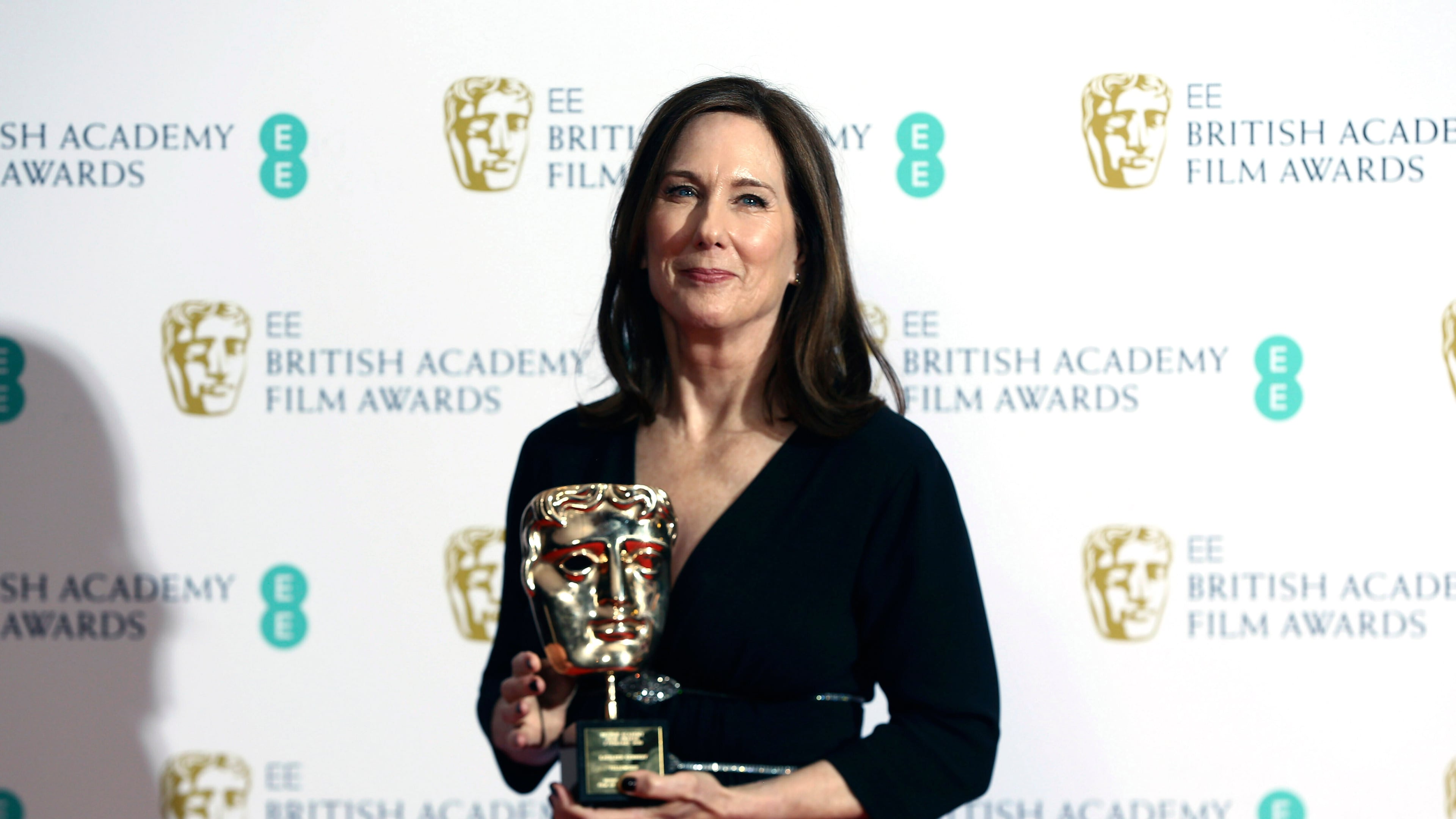FILE - Kathleen Kennedy, winner of the BAFTA Fellowship, poses with her award backstage at the BAFTA Film Awards in central London, Feb. 2, 2020. (Photo by Joel C Ryan/Invision/AP, File)