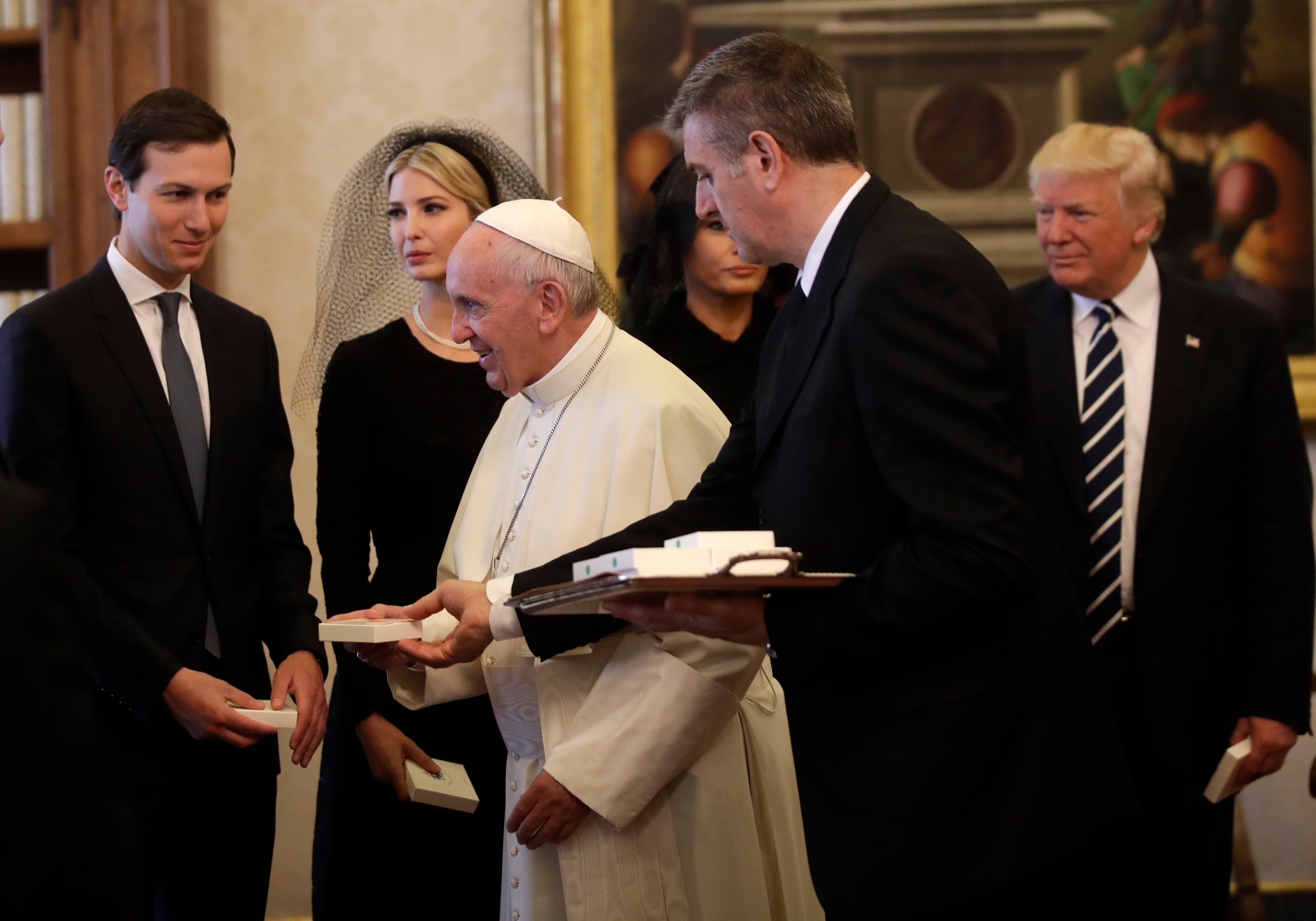 Pope Francis walks past from left, Jared Kushner, senior advisor of President Donald Trump, Ivanka Trump, Melania Trump and President Donald Trump, on the occasion of their private audience, at the Vatican, Wednesday, May 24, 2017. (AP Photo/Alessandra Tarantino, Pool)