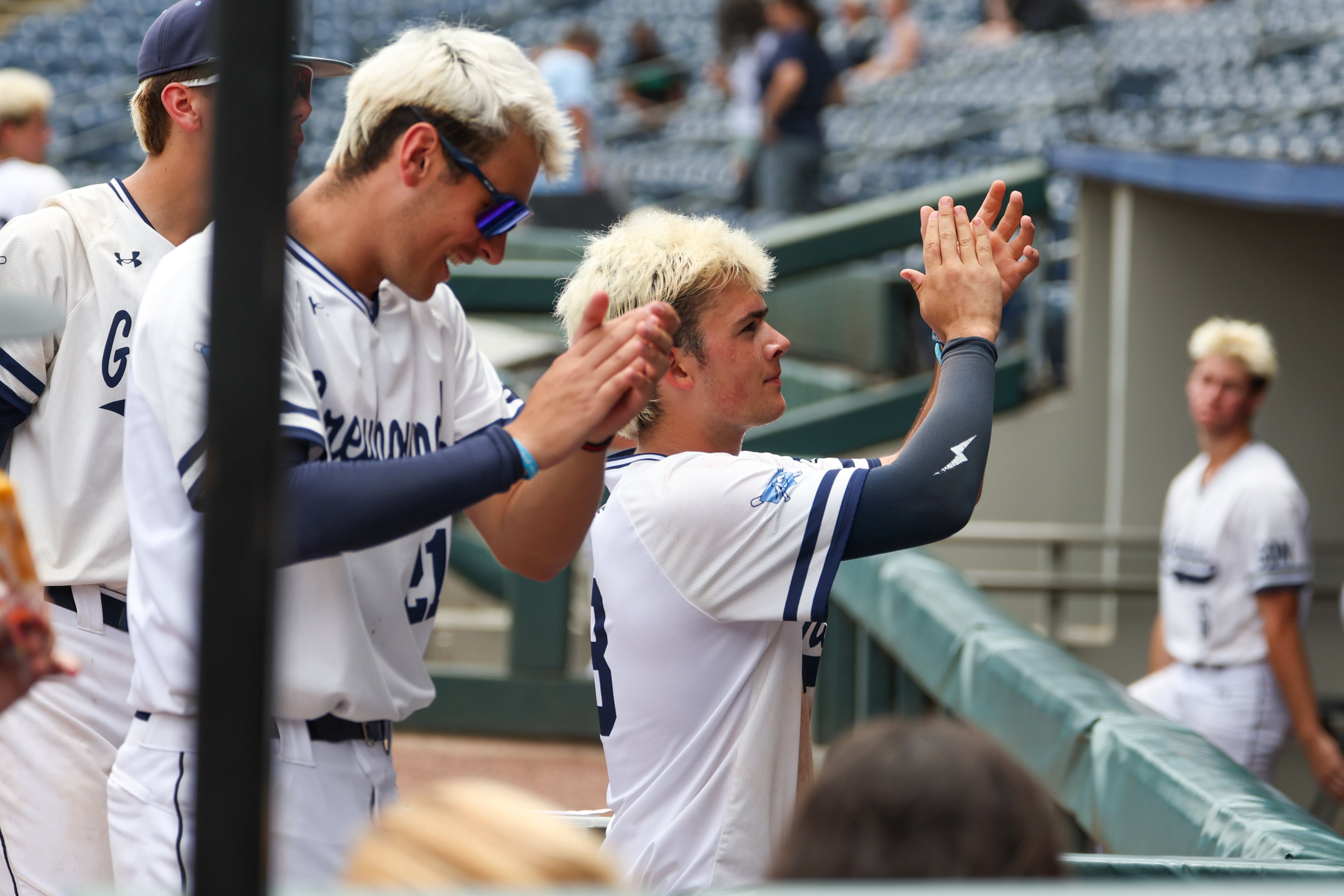 Players celebrate a win over Loganville in Game 2 of their GHSA Class 5A baseball championship series at Gwinnett Field on Tuesday, May 26, 2026, in Lawrenceville. (Arvin Temkar/AJC)