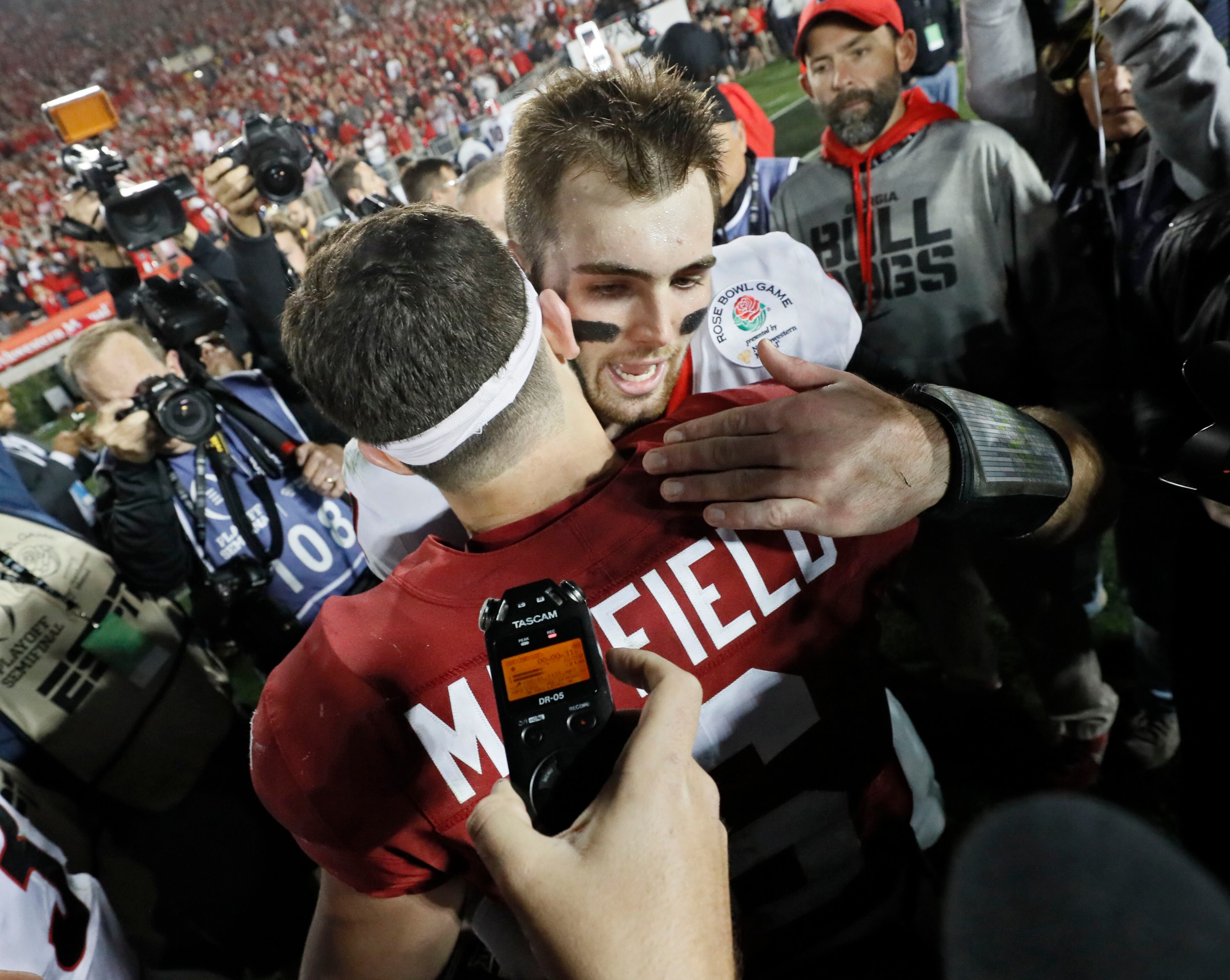 1/1/18 - Pasadena - Oklahoma Sooners quarterback Baker Mayfield (6) congratulates Georgia Bulldogs quarterback Jake Fromm (11) after Georgia won the College Football Playoff Semifinal at the Rose Bowl Game on Monday, January 1, 2018, in Pasadena. BOB ANDRES /BANDRES@AJC.COM
