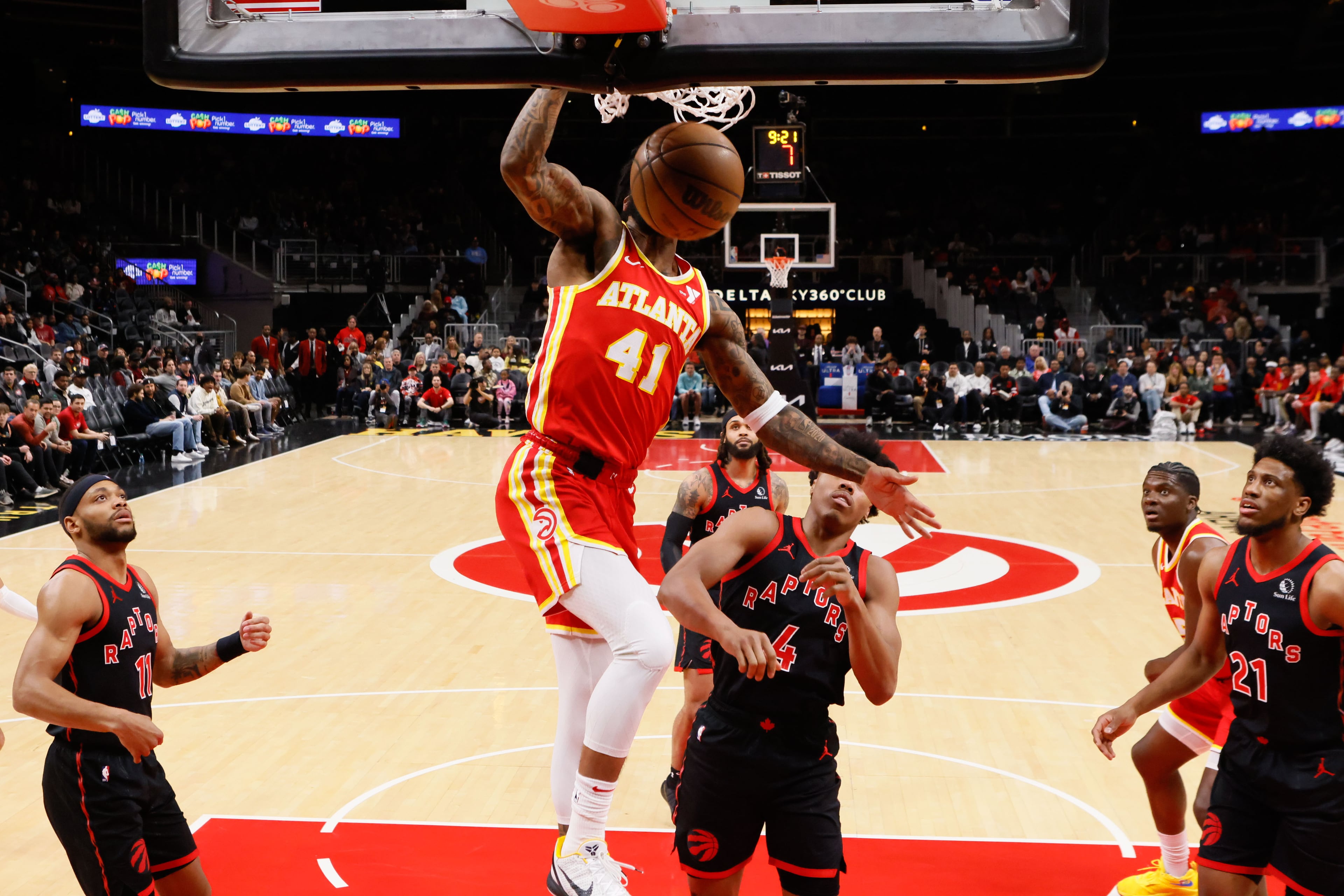 Hawks win: Forward Saddiq Bey (41) had the big slam at the end of Sunday's thrilling win over the Raptors at State Farm Arena.
Miguel Martinez / miguel.martinezjimenez@ajc.com