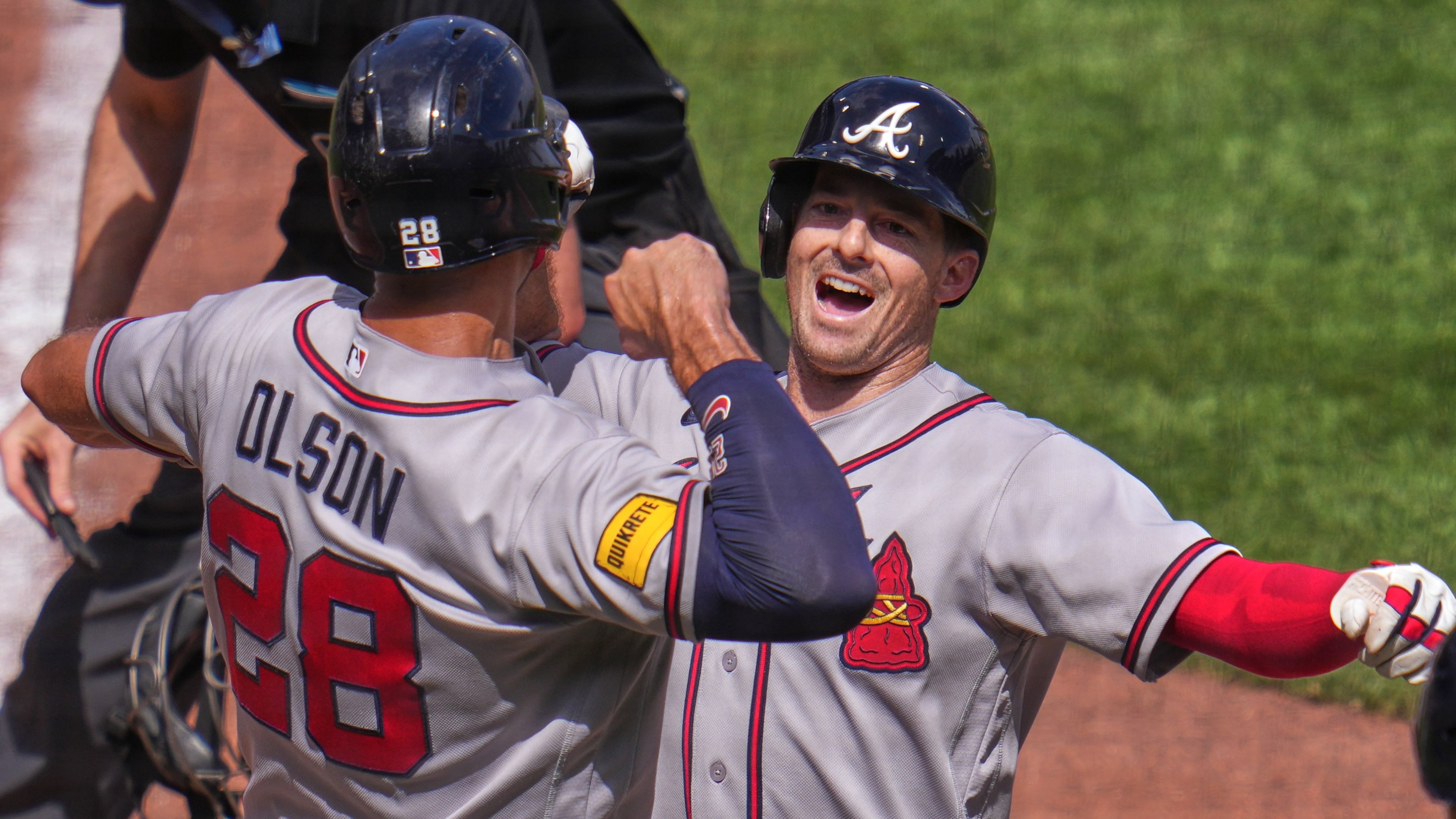 Atlanta Braves' Mike Yastrzemski, right, celebrates with Matt Olson (28) as he crosses home plate after hitting a grand slam off Pittsburgh Pirates pitcher Dennis Santana during the ninth inning of a baseball game in Pittsburgh, Thursday, July 9, 2026. (AP Photo/Gene J. Puskar)