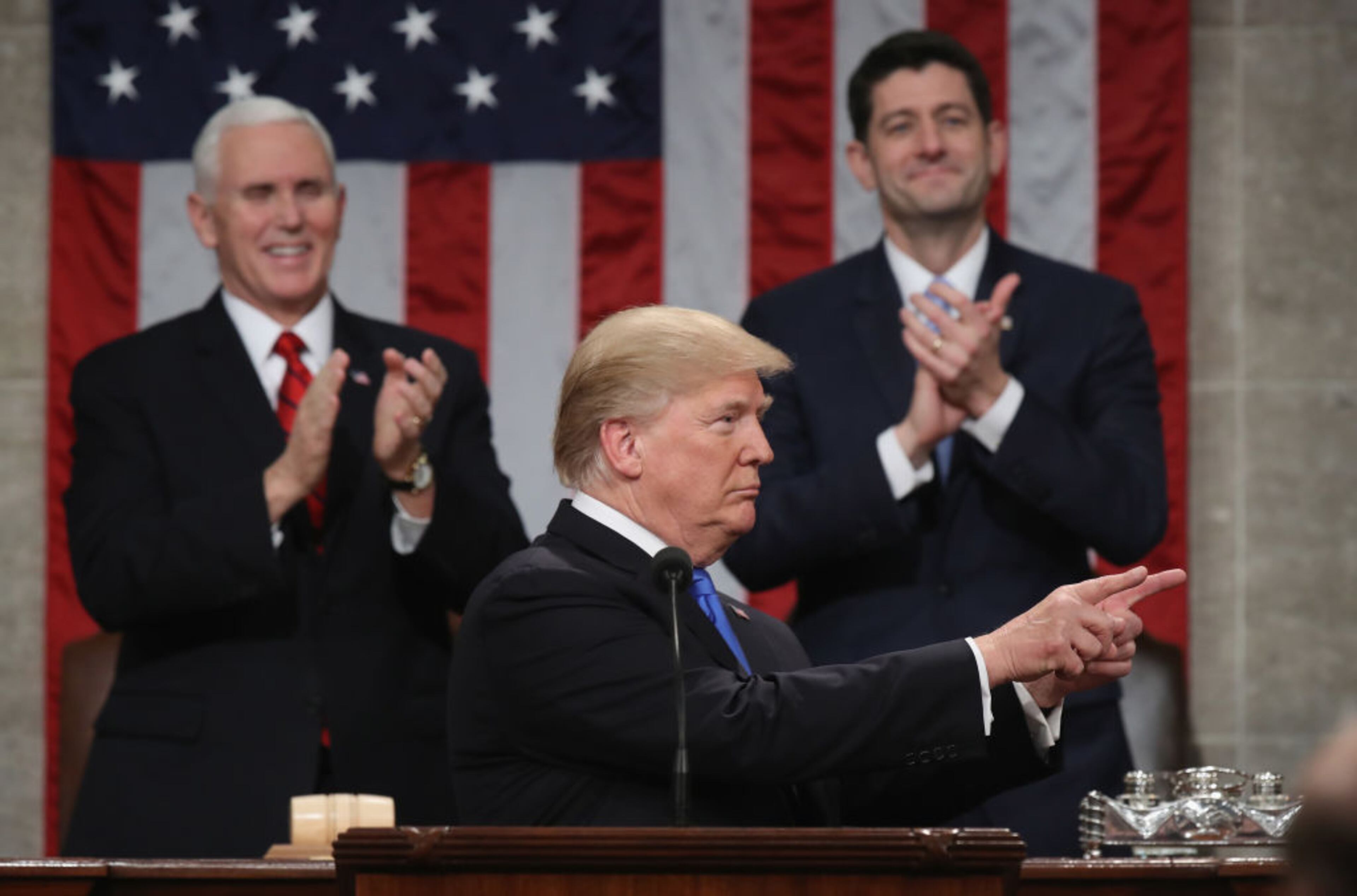 WASHINGTON, DC - JANUARY 30: U.S. President Donald J. Trump delivers the State of the Union address as U.S. Vice President Mike Pence (L) and Speaker of the House U.S. Rep. Paul Ryan (R-WI) (R) look on in the chamber of the U.S. House of Representatives January 30, 2018 in Washington, DC. This is the first State of the Union address given by U.S. President Donald Trump and his second joint-session address to Congress. (Photo by Win McNamee/Getty Images)