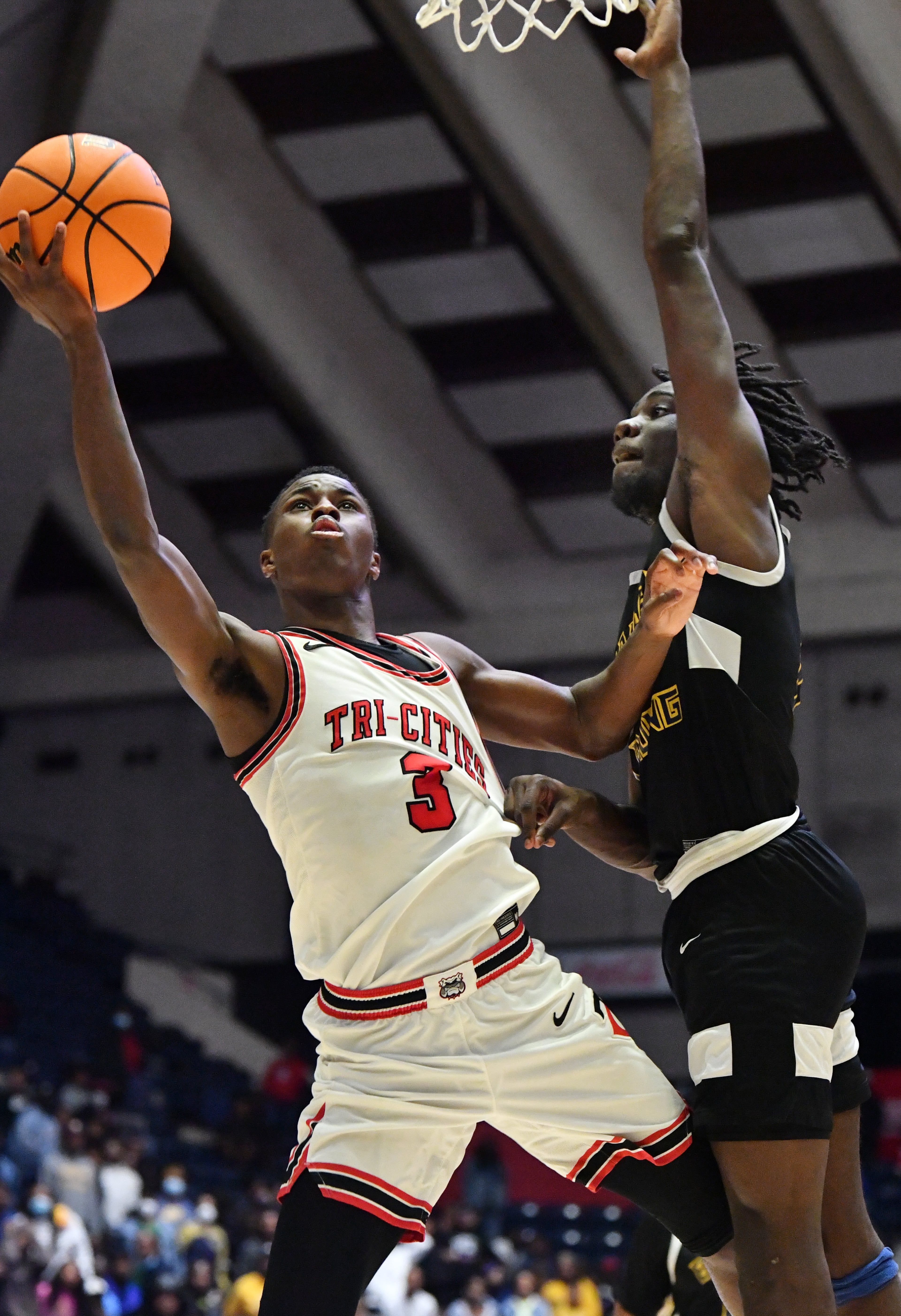 Tri-Cities' Kory Mincy (left) shoots against Eagle's Landing's Jordan Fordyce. (Hyosub Shin / Hyosub.Shin@ajc.com)