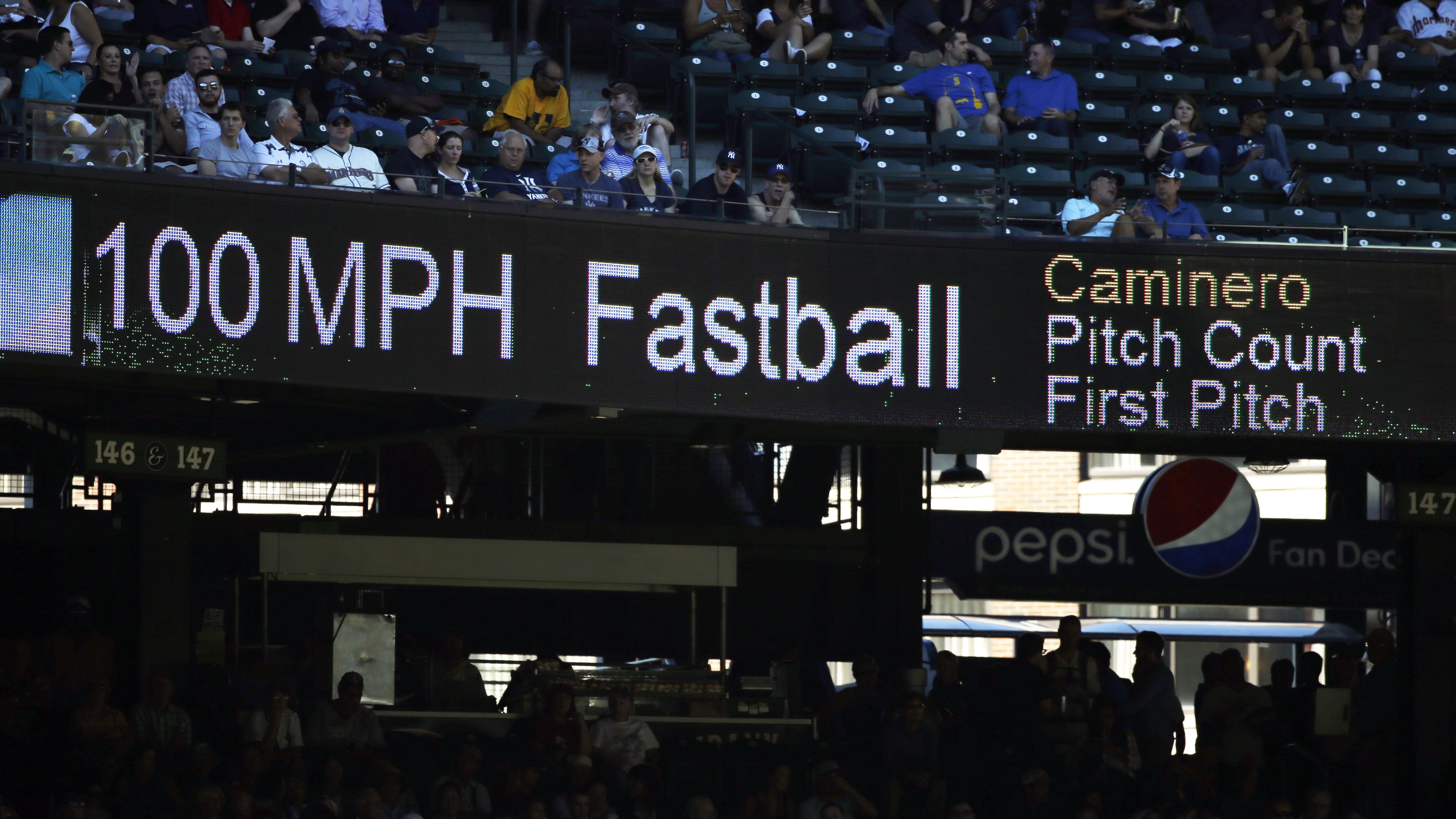 FILE - The 100 mph speed of Seattle Mariners' Arquimedes Caminero's fastball is shown on a scoreboard during a baseball game against the New York Yankees, Aug. 24, 2016, in Seattle. (AP Photo/Elaine Thompson, File)