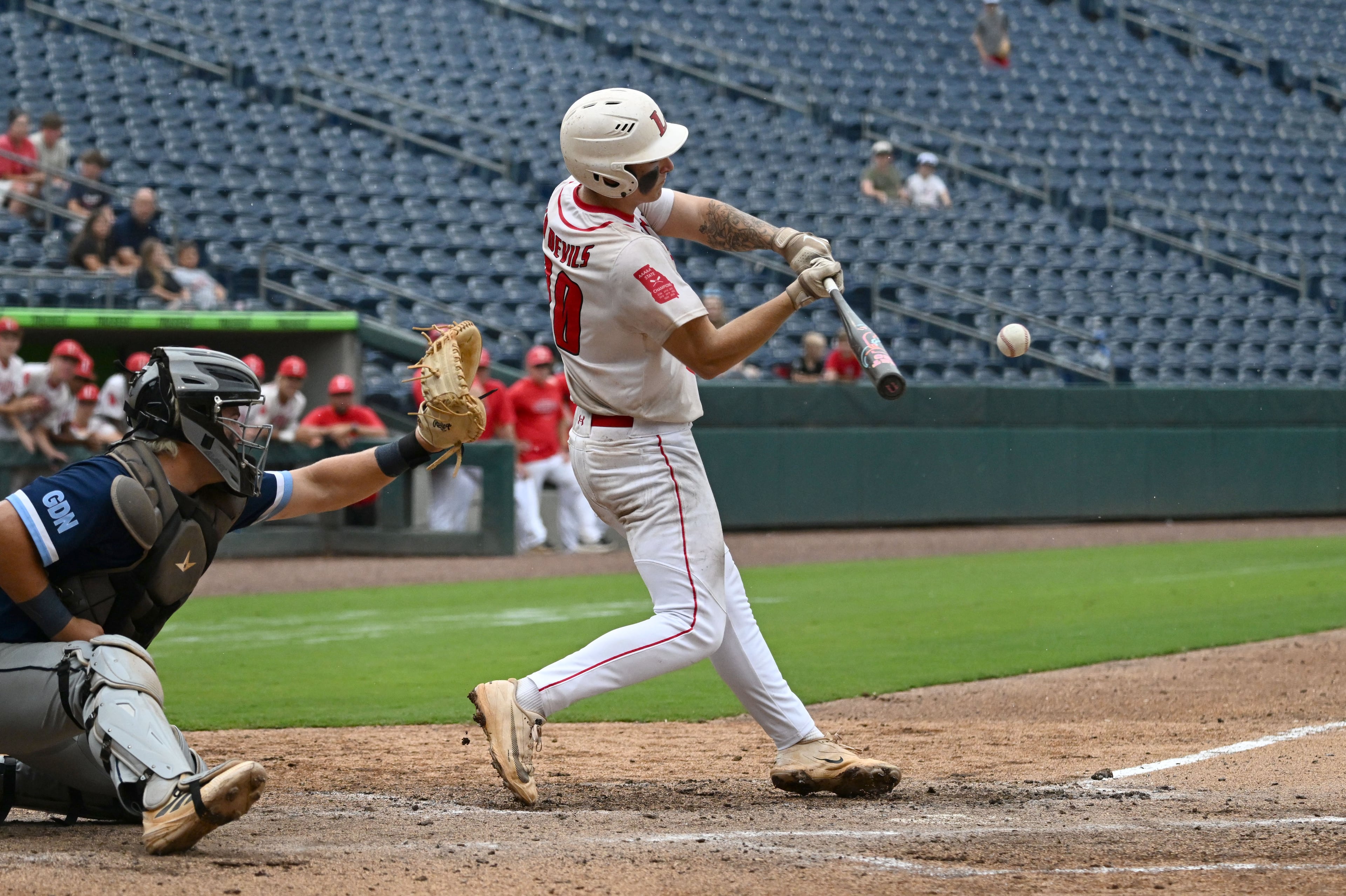 Loganville's Jake Boland hits a sacrifice to score Brantley Carter during the sixth inning of Game 1 of the GHSA Class 5A baseball state championship series Monday, May 25, 2026, at Gwinnett Field in Lawrenceville. (Hyosub Shin/AJC)