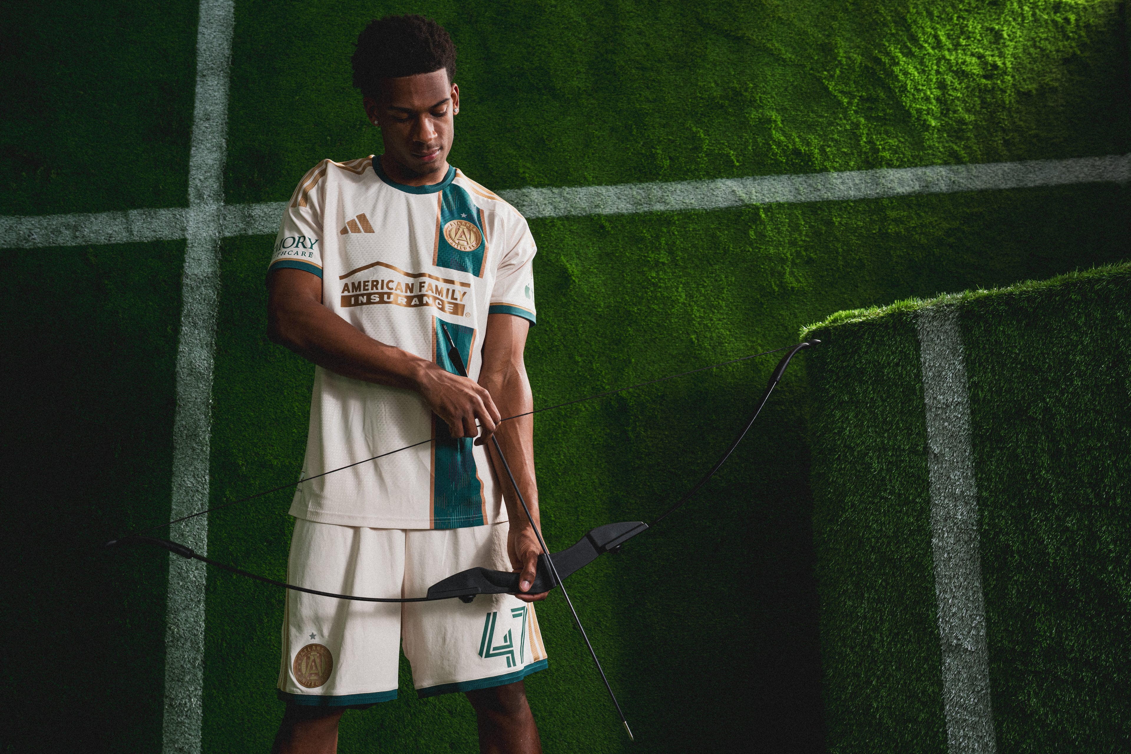 Atlanta United defender Matt Edwards wears the new “Spirit of ’96” kit, designed to honor Atlanta’s past as host of the 1996 Summer Games and its present as host of eight World Cup matches this summer. (Mitch Martin/Atlanta United)