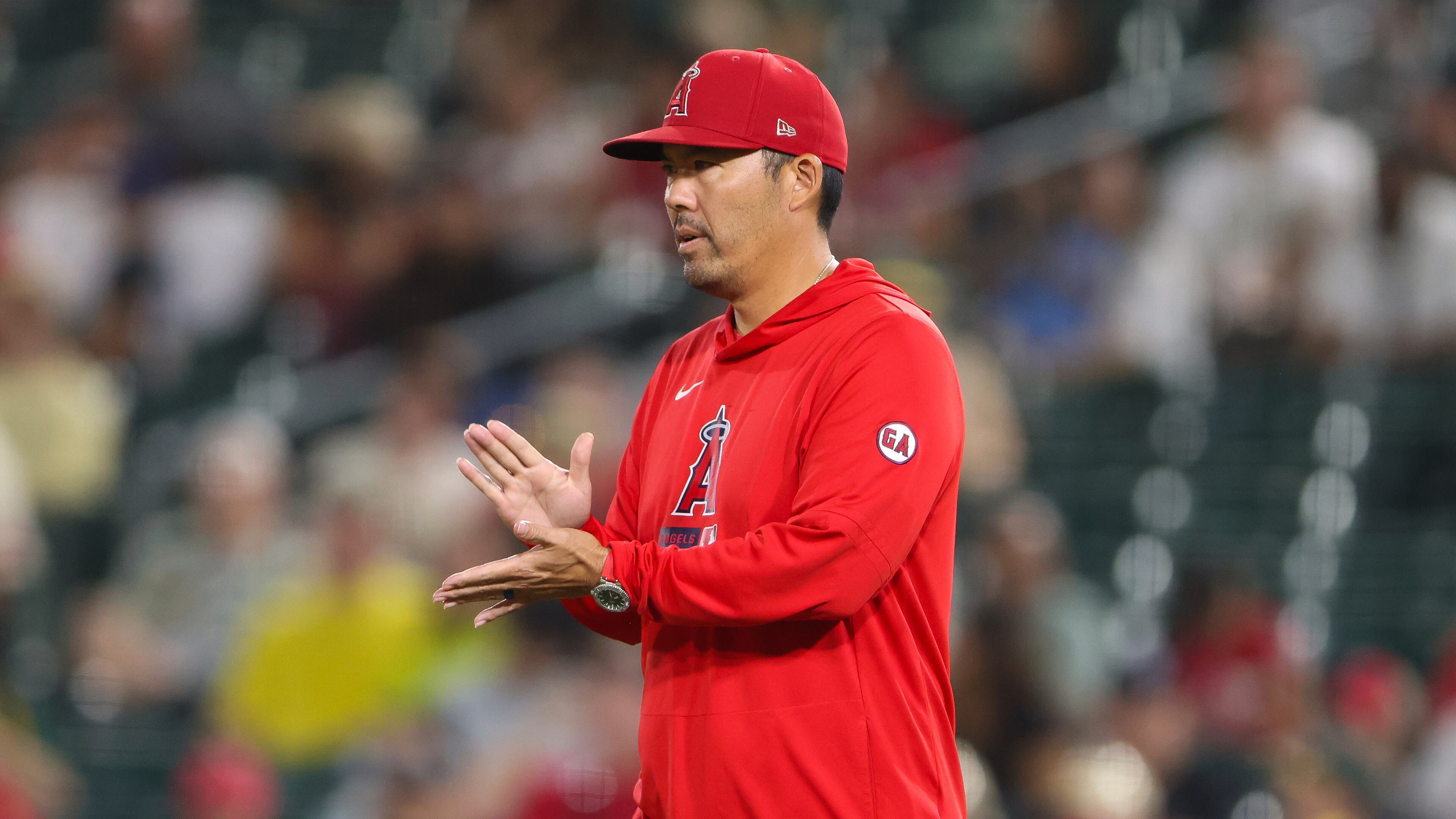 Los Angeles Angels manager Kurt Suzuki walks to the mound as he makes a pitching change during the fifth inning of a baseball game against the Athletics Wednesday, Sept. 23, 2026, in West Sacramento, Calif. (AP Photo/Scott Marshall)