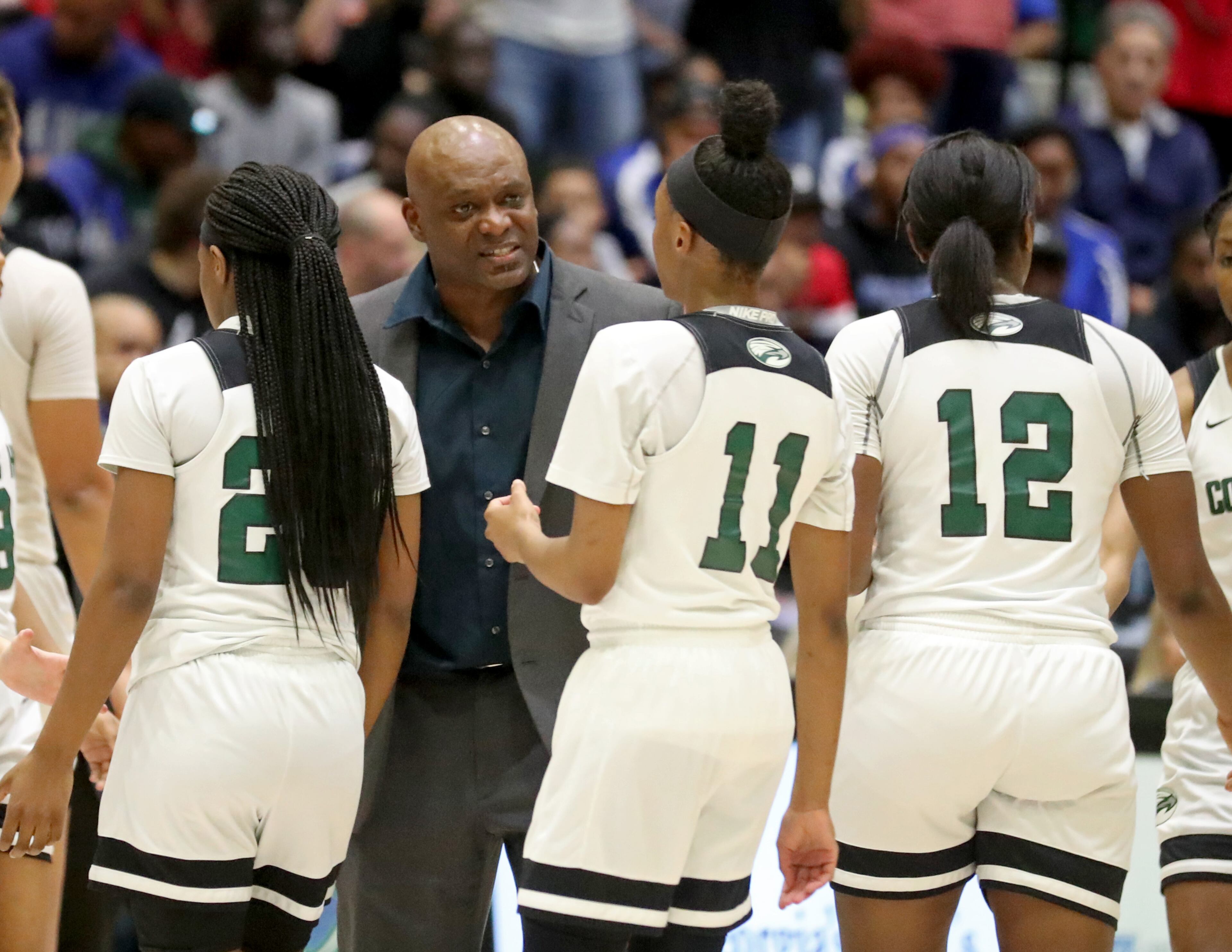 March 2, 2019 - Buford, Ga: Collins Hill coach Brian Harmon, center, talks with guard Bria Harmon (11) in the first half against Cherokee in the Class AAAAAAA semifinals at the Buford City Arena Saturday, March 2, 2019 in Buford, Ga. Collins Hill won 58-48. (JASON GETZ/SPECIAL TO THE AJC)