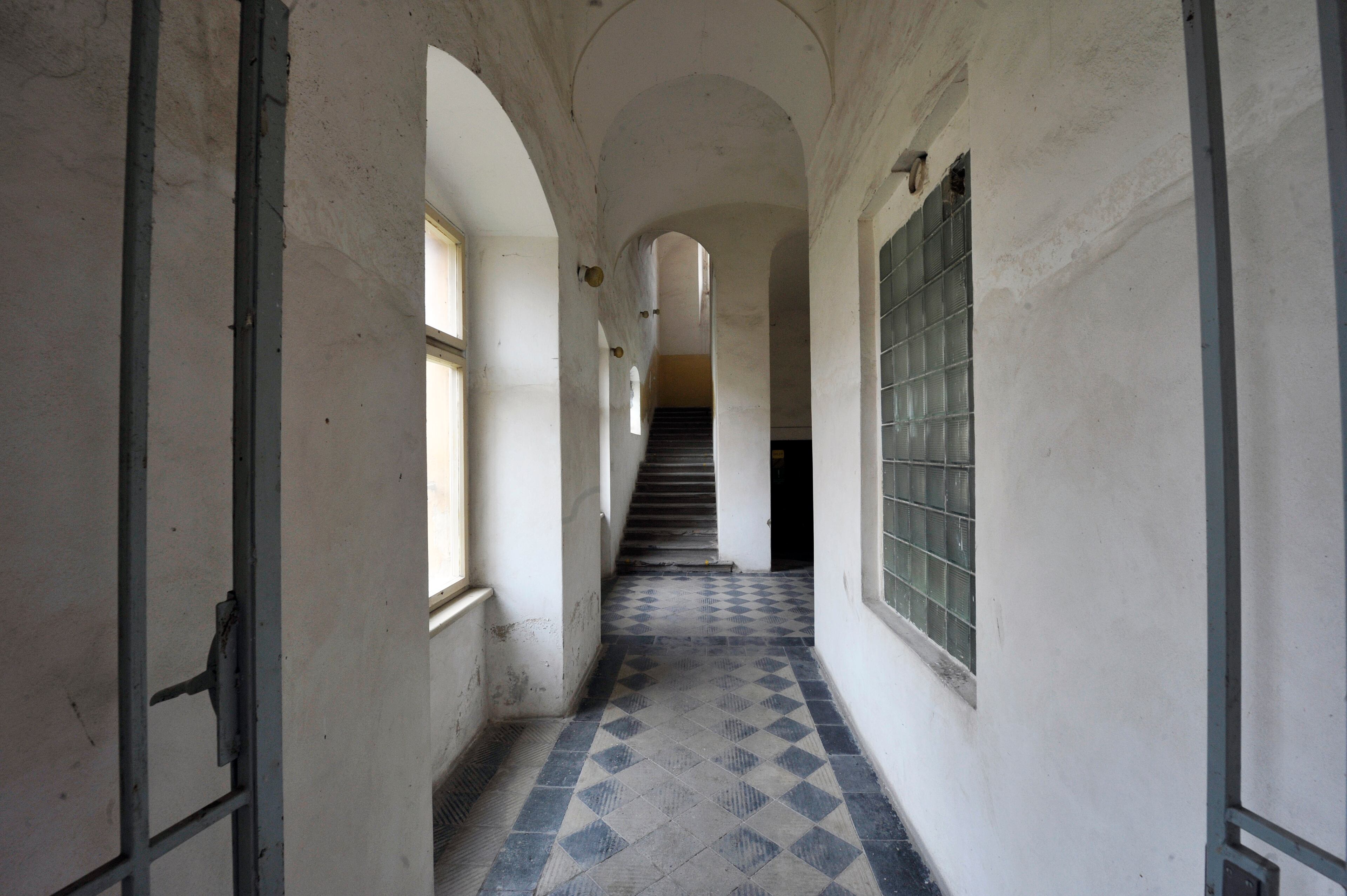 Recent view inside Building L410 in Terezin with its cold, damp hallways. Nearly every child who lived in this building during the war perished — either from disease or by being sent to their deaths in Auschwitz.