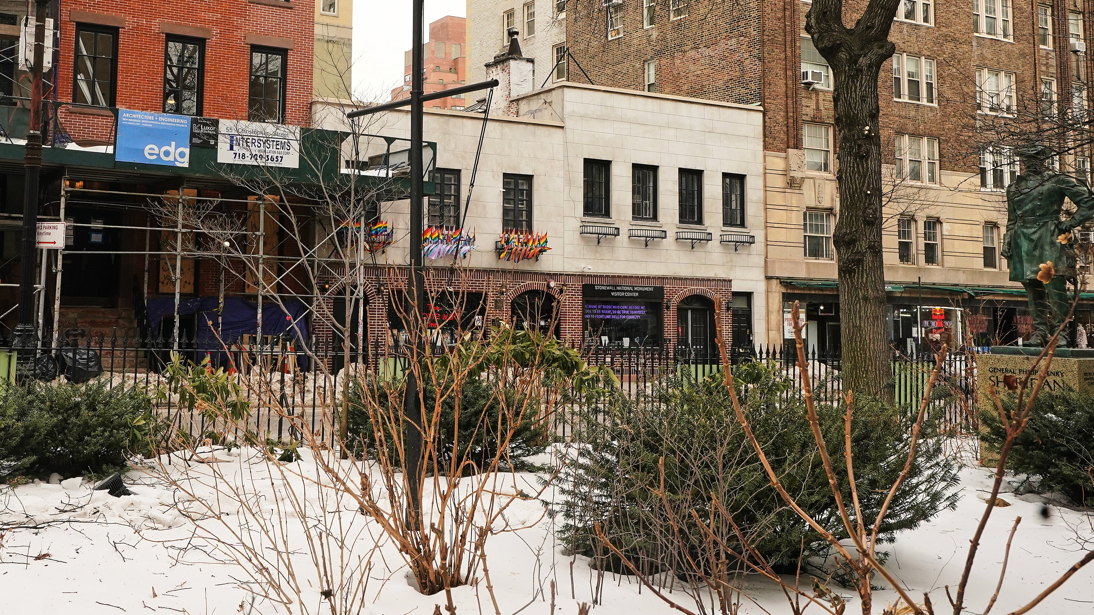 The Trump administration has stopped flying a rainbow flag on the pole, center, in the Stonewall National Monument, adjacent to the Stonewall Inn, background center, in New York, Tuesday, Feb. 10, 2026. (AP Photo/Richard Drew)