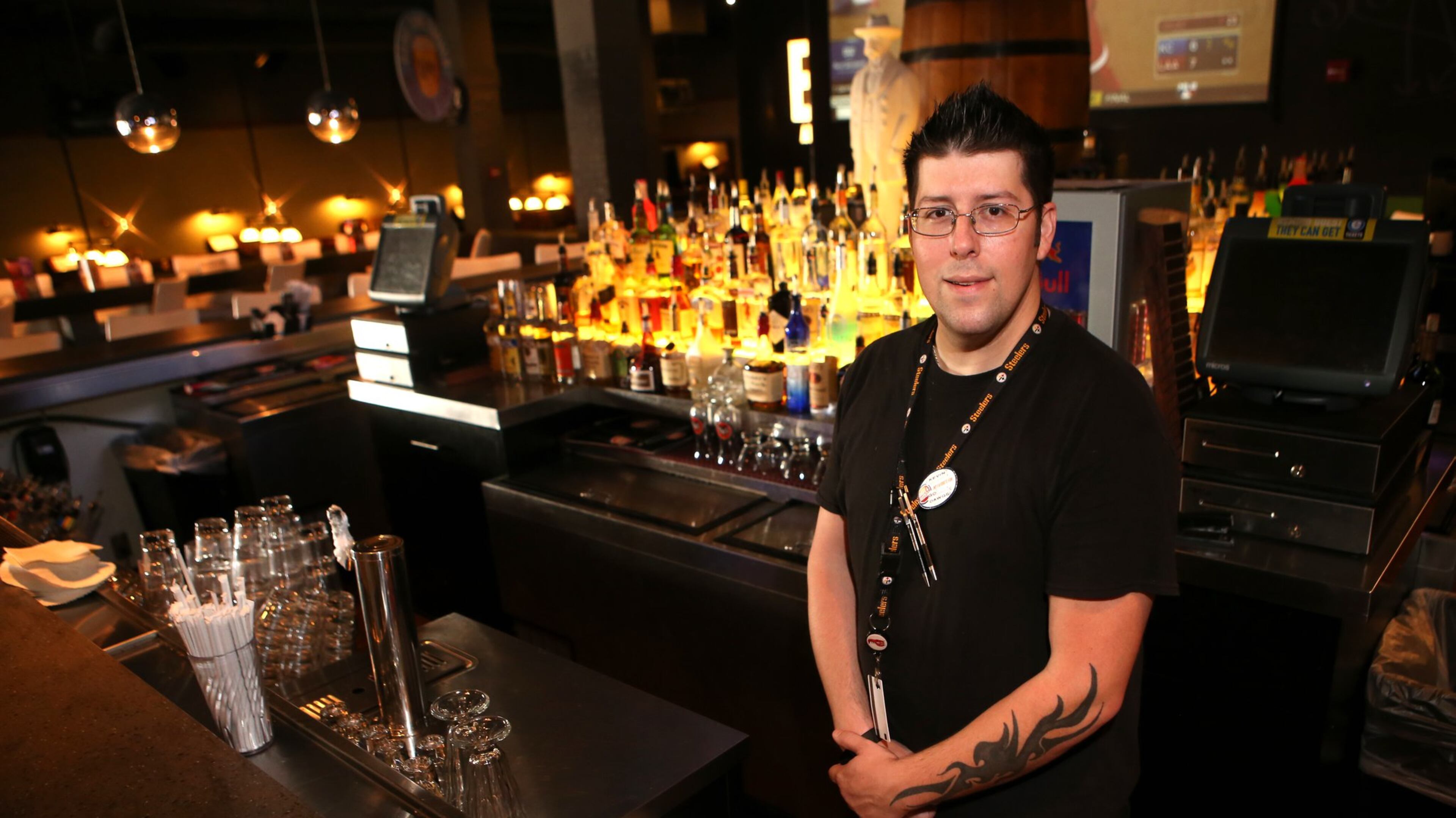 Kevin Colpo, 33, a bartender at Dave & Busters, at the Marietta location. Colpo has been working there for two years and makes $8.50 an hour plus tips. The service and hospitality sectors have seen strong growth since the recession. (HENRY TAYLOR / HENRY.TAYLOR@AJC.COM)