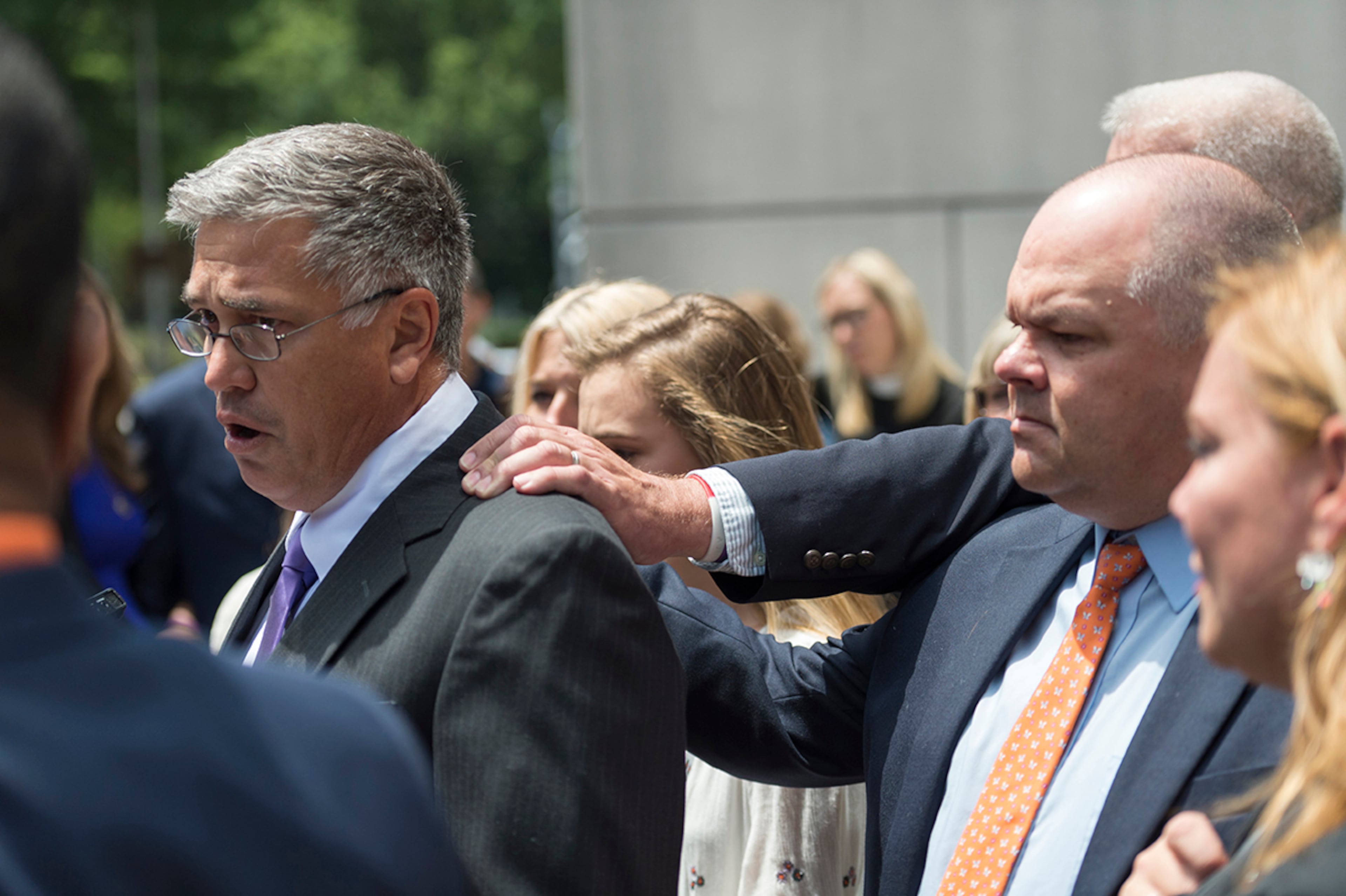 May 17, 2017, Atlanta - Family members of the victims who were murdered behind a Roswell grocery store console each other while speaking to the press after a sentencing in Atlanta, Georgia, on Wednesday, May 17, 2017. Jeffery Hazelwood, not pictured, plead guilty to all charges involving the murder of Carter Davis and Natalie Henderson. (DAVID BARNES / DAVID.BARNES@AJC.COM)