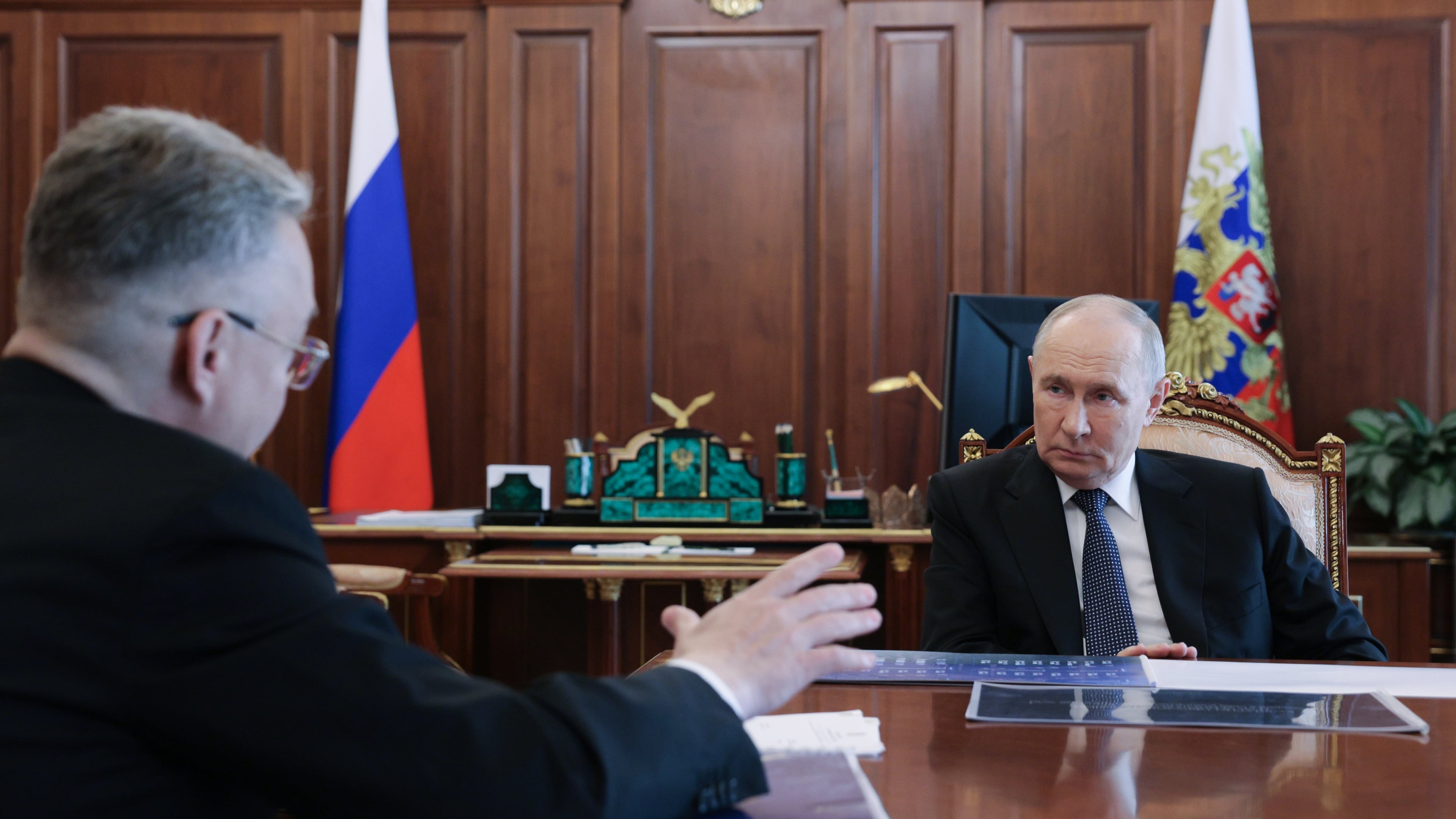 Russian President Vladimir Putin, right, listens to Stavropol region governor Vladimir Vladimirov during their meeting at the Kremlin in Moscow, Tuesday, Aug. 25, 2026. (Mikhail Metzel/Sputnik, Kremlin Pool Photo via AP)