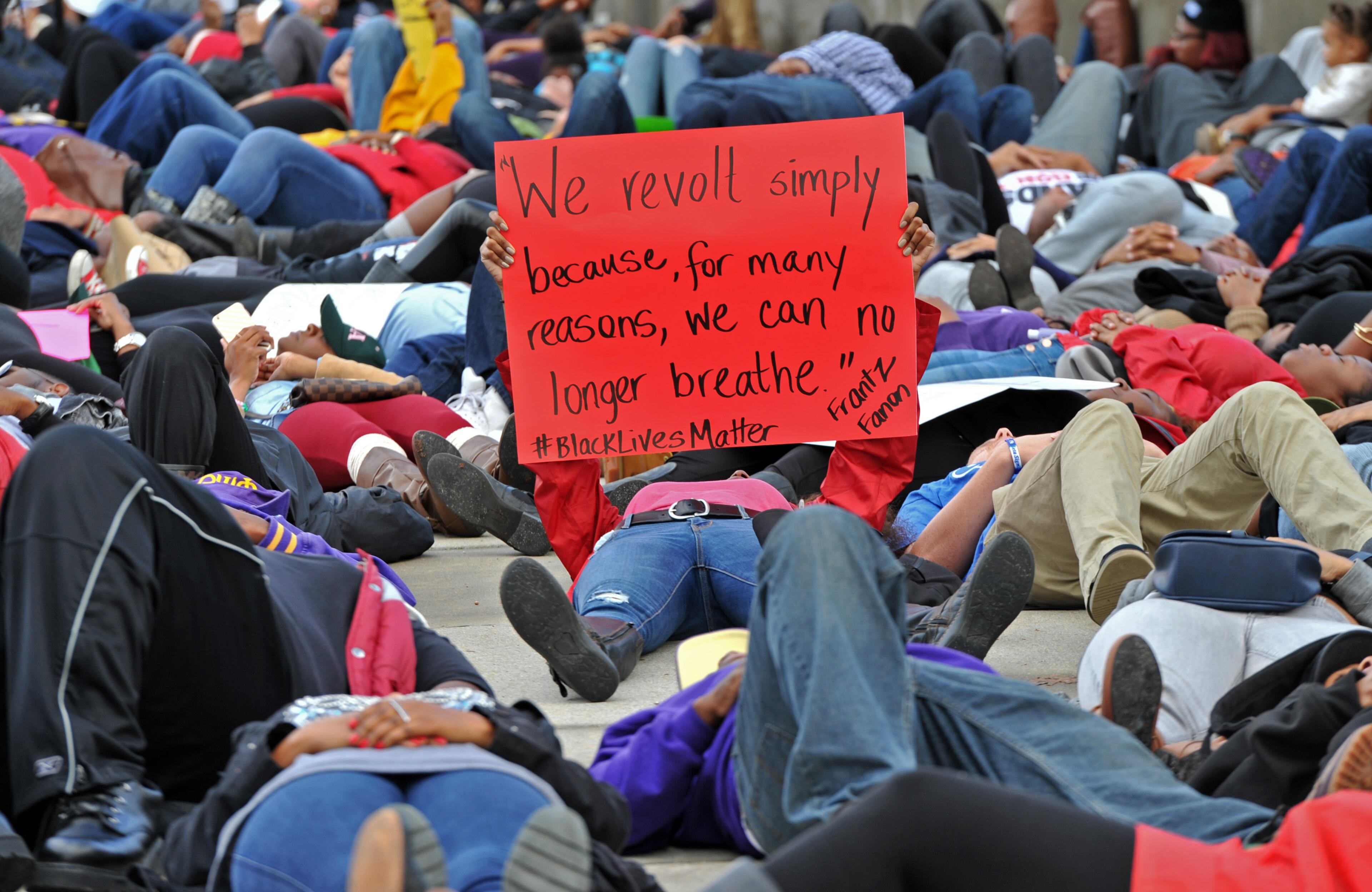December 6, 2014 Atlanta - Protesters participate in a "die-in" on the 17th Street Bridge near Atlantic Station during their peaceful demonstration against decisions not to indict white police officers in the deaths of unarmed black men in Ferguson, Mo., and in New York City on Saturday, December 6, 2014. HYOSUB SHIN / HSHIN@AJC.COM