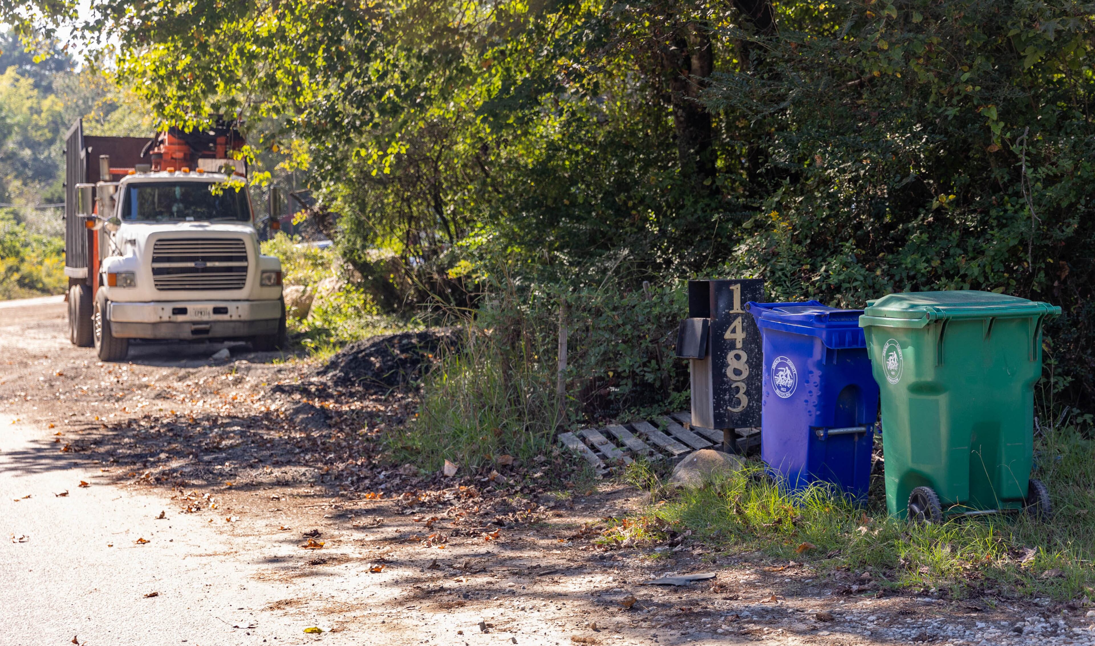 Stonecrest zoning has created several locations including Coffee Road where illegal dumping and overflow parking is adjacent to abandoned, overgrown homes Wednesday, Sept 29, 2021. Some residential properties, like 1483 Coffee Road shown here, are occupied and are next to industrial operations. (Jenni Girtman for The Atlanta Journal-Constitution)