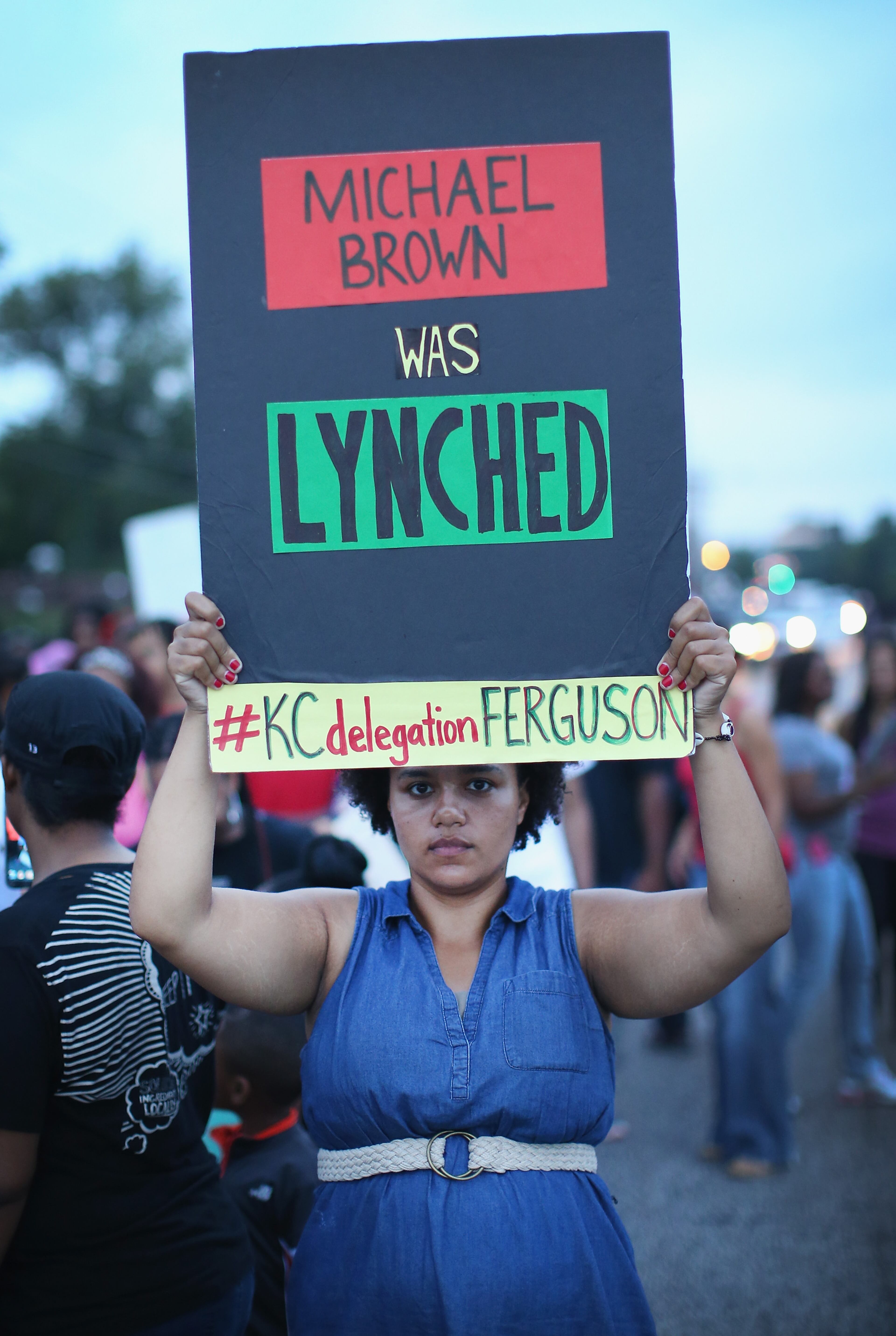 Demonstrators protests along Florissant Avenue on August 16, 2014 in Ferguson, Missouri. Violent protests have erupted nearly every night along the street since the shooting death of teenager Michael Brown by a Ferguson police officer on August 9. (Photo by Scott Olson/Getty Images)