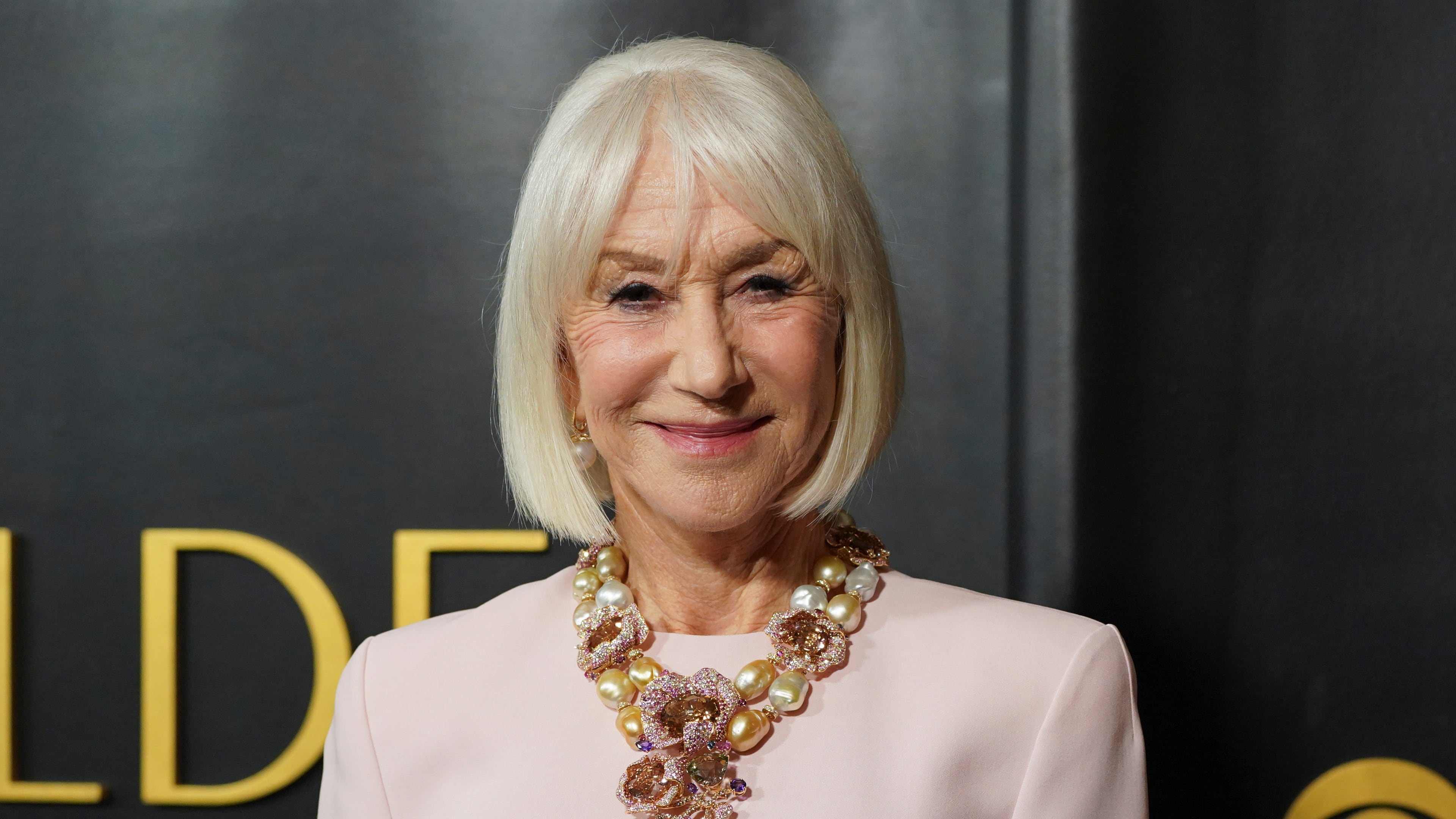 FILE - Helen Mirren arrives at the Golden Globes Golden Eve on Tuesday, Jan. 6, 2026, at The Beverly Hilton Hotel, in Beverly Hills, Calif. (Photo by Jordan Strauss/Invision/AP)