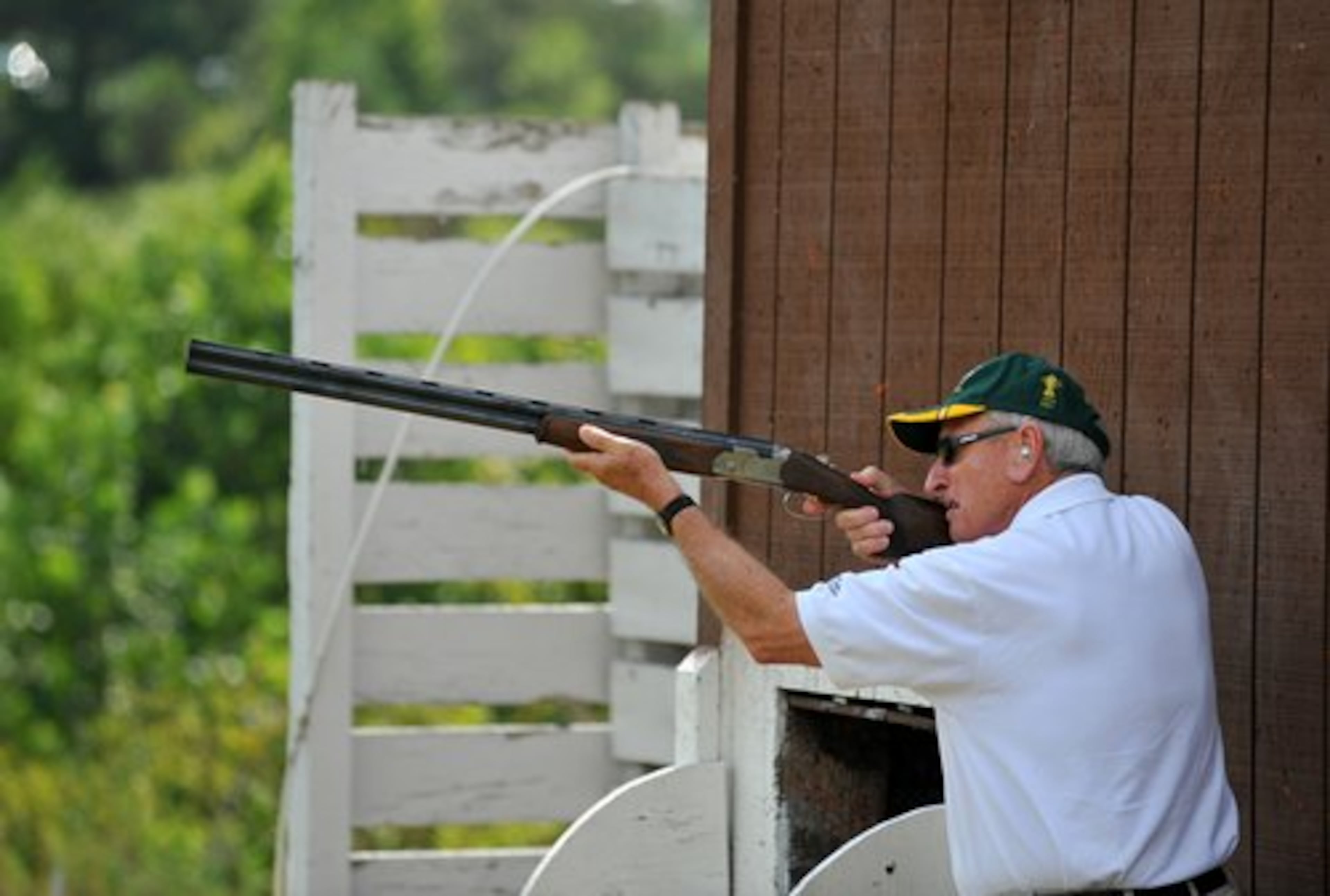 Georgia coaching legend Vince Dooley shoots Skeet at the Tom Lowe Trap and Skeet Range Saturday in Atlanta. Dooley was one of several sports stars and celebrities paired with war veterans for the event, presented by the North Metro Miracle League and the Faces of Freedom.
