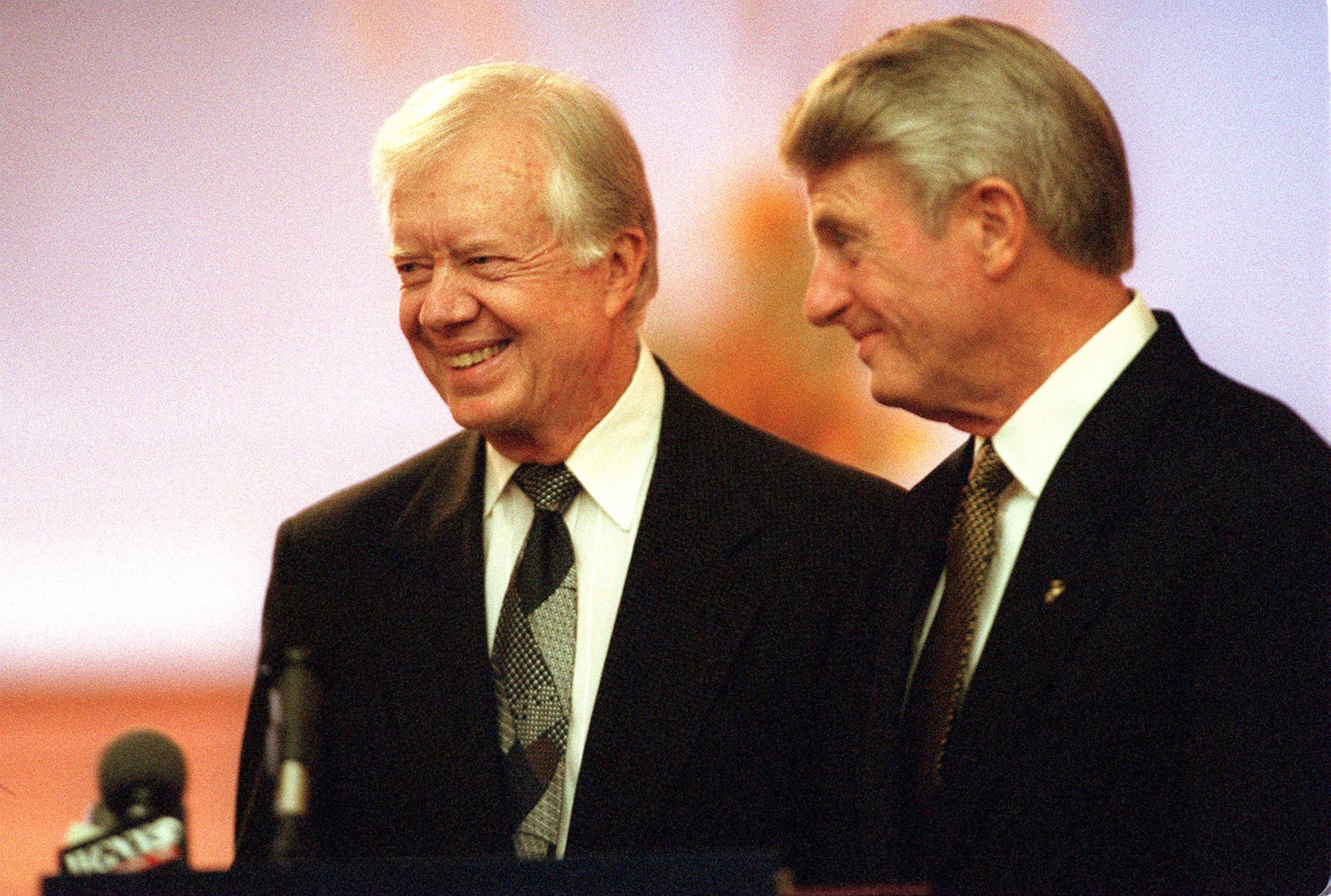 971022 - ATLANTA, GA - Former President Jimmy Carter, left, during the ceremony at the Carter Center held on October 22, 1997. Governor Zell Miller, right, made the proclamation declaring Oct. 22 as Carter Center Day in honor of the 15th anniversary of the Carter Center. (W.A. BRIDGES JR./AJC staff)