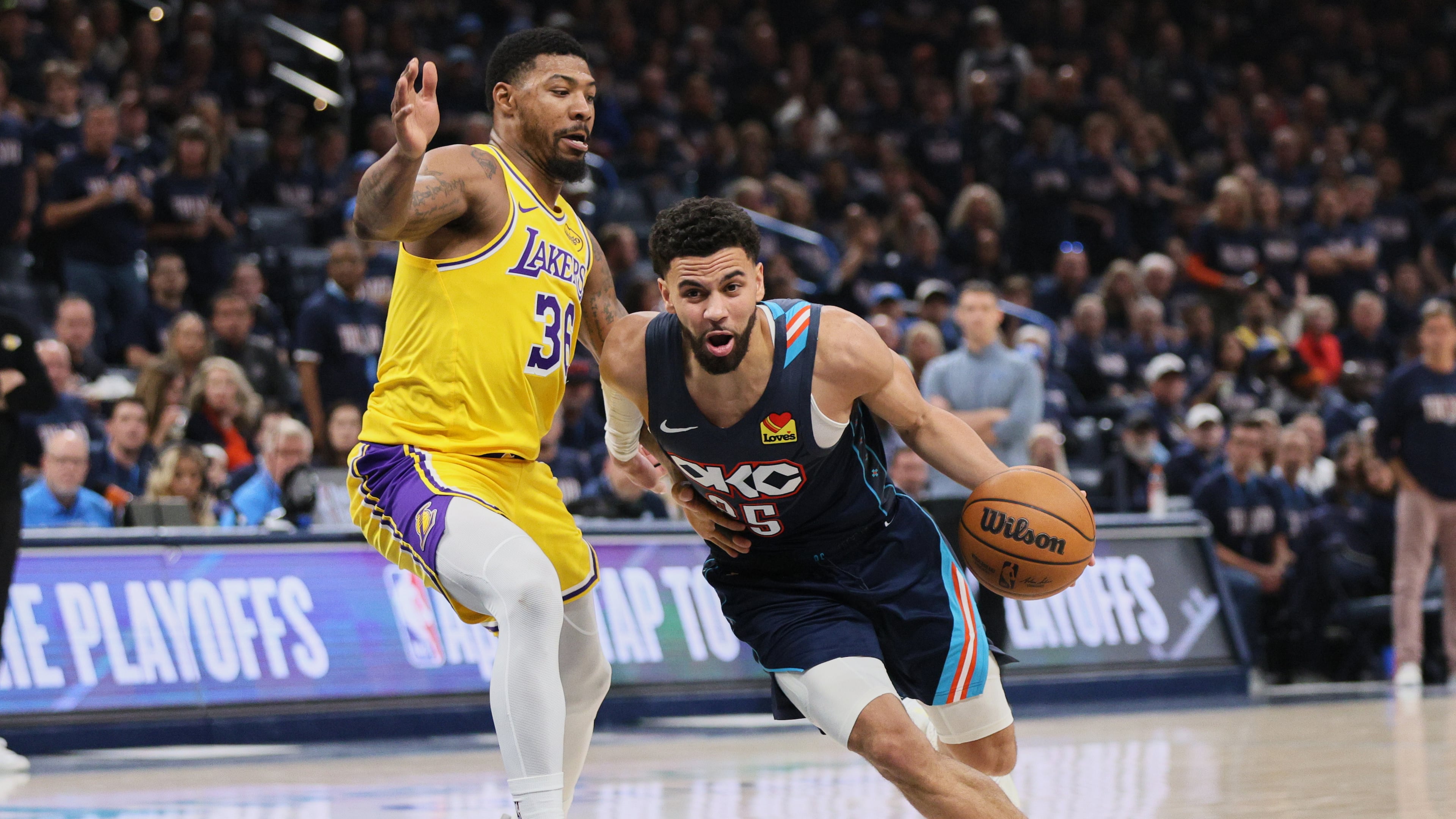 Oklahoma City Thunder guard Ajay Mitchell (25) drives to the basket against Los Angeles Lakers' Marcus Smart (36) in the second half of Game 2 in a second-round NBA basketball playoffs series Thursday, May 7, 2026, in Oklahoma City. (AP Photo/Nate Billings)