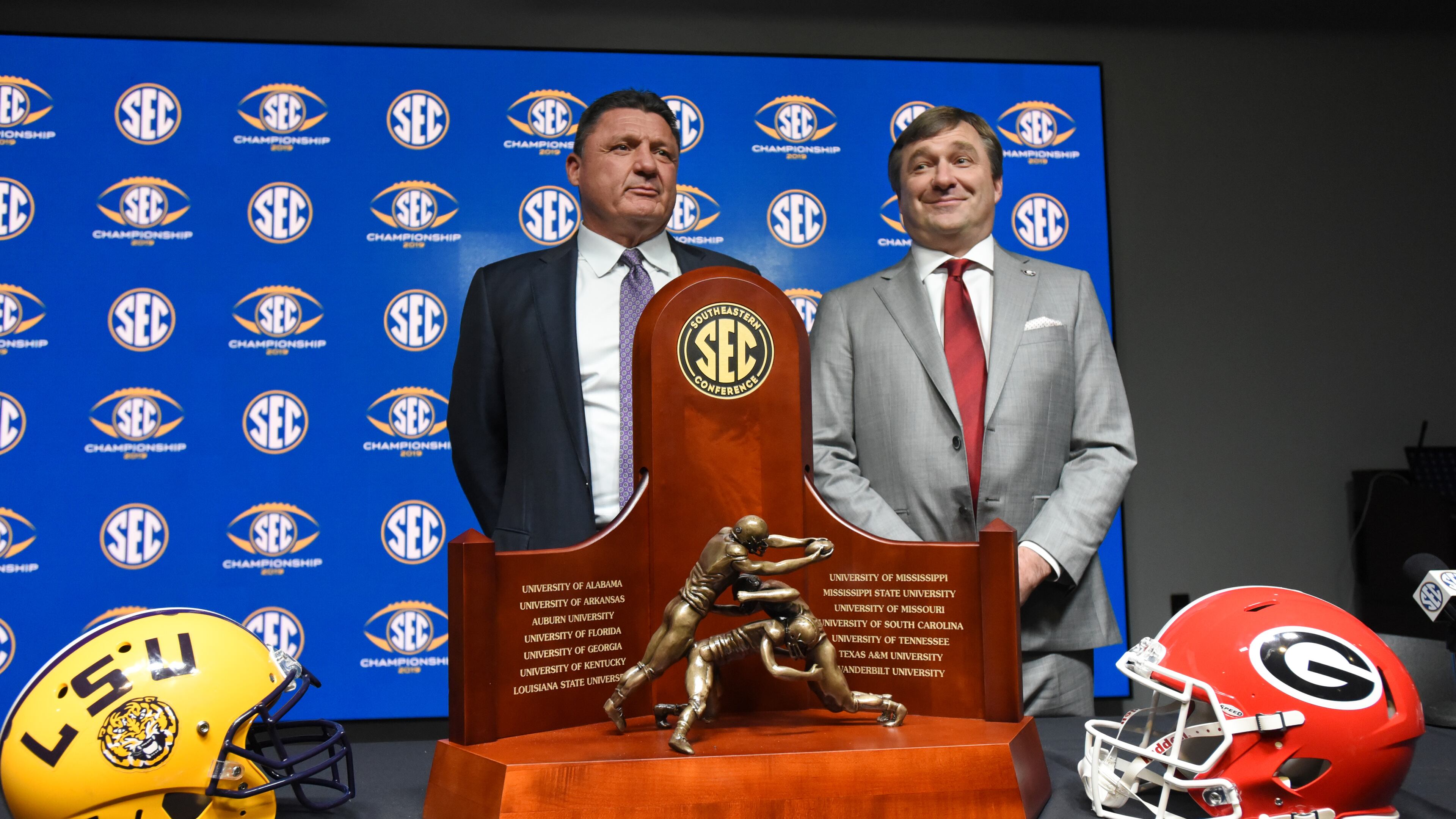 December 6, 2019 Atlanta - UGA Head Coach Kirby Smart and LSU Head Coach Ed Orgeron pose for photographers during a press conference at Mercedes-Benz Stadium on Friday, December 6, 2019. (Hyosub Shin / Hyosub.Shin@ajc.com)