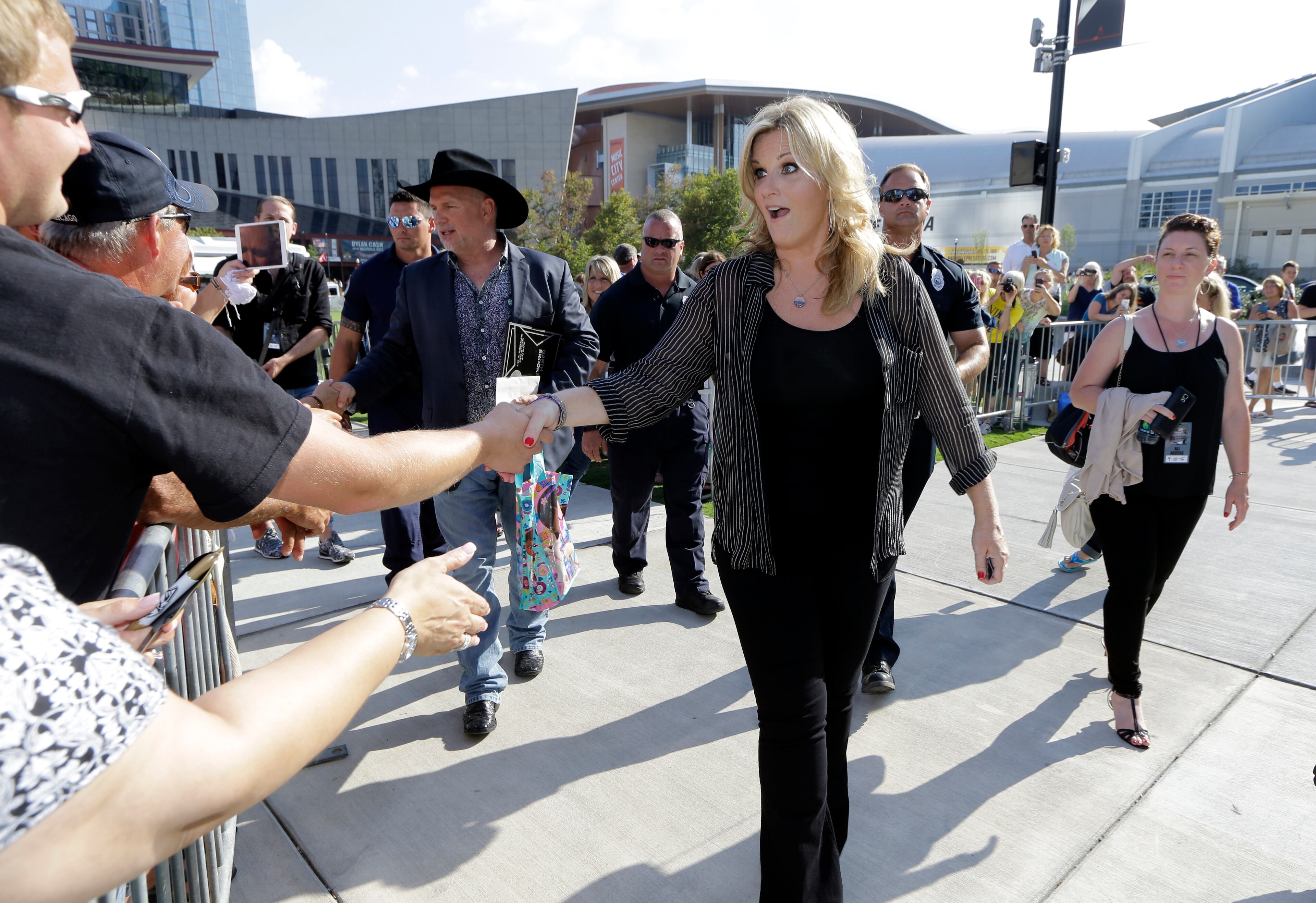 Garth Brooks and Trisha Yearwood greet fans after they both received a star on the Music City Walk of Fame on Thursday, Sept. 10, 2015, in Nashville, Tenn. (AP Photo/Mark Humphrey)