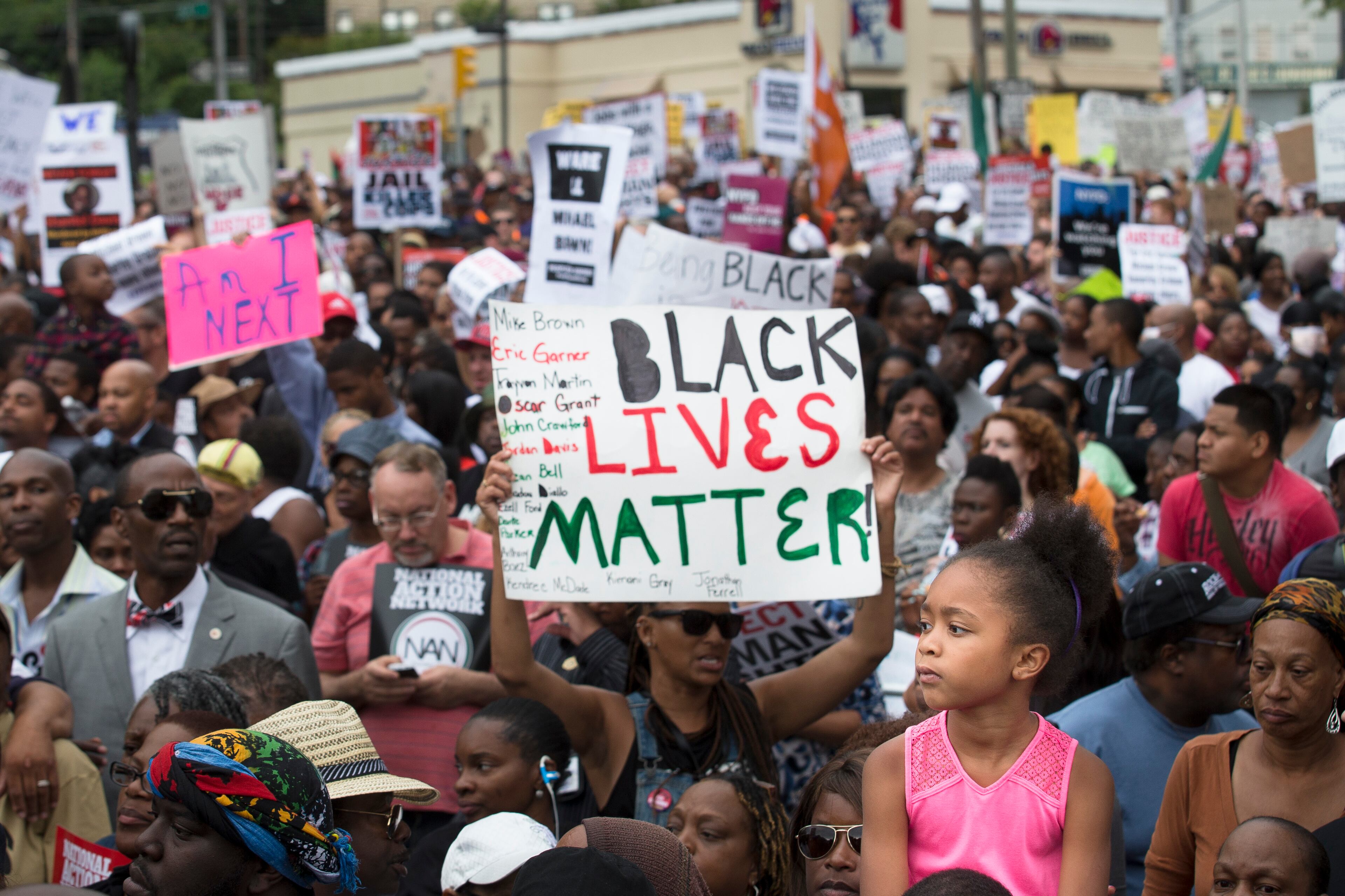 Demonstrators march to protest the death of Eric Garner, Saturday, Aug. 23, 2014, in the Staten Island borough of New York. The city medical examiner ruled that Eric Garner, 43, died as a result of a police chokehold during an attempted arrest. The march was led by the Rev. Al Sharpton's National Action Network. (AP Photo/John Minchillo)