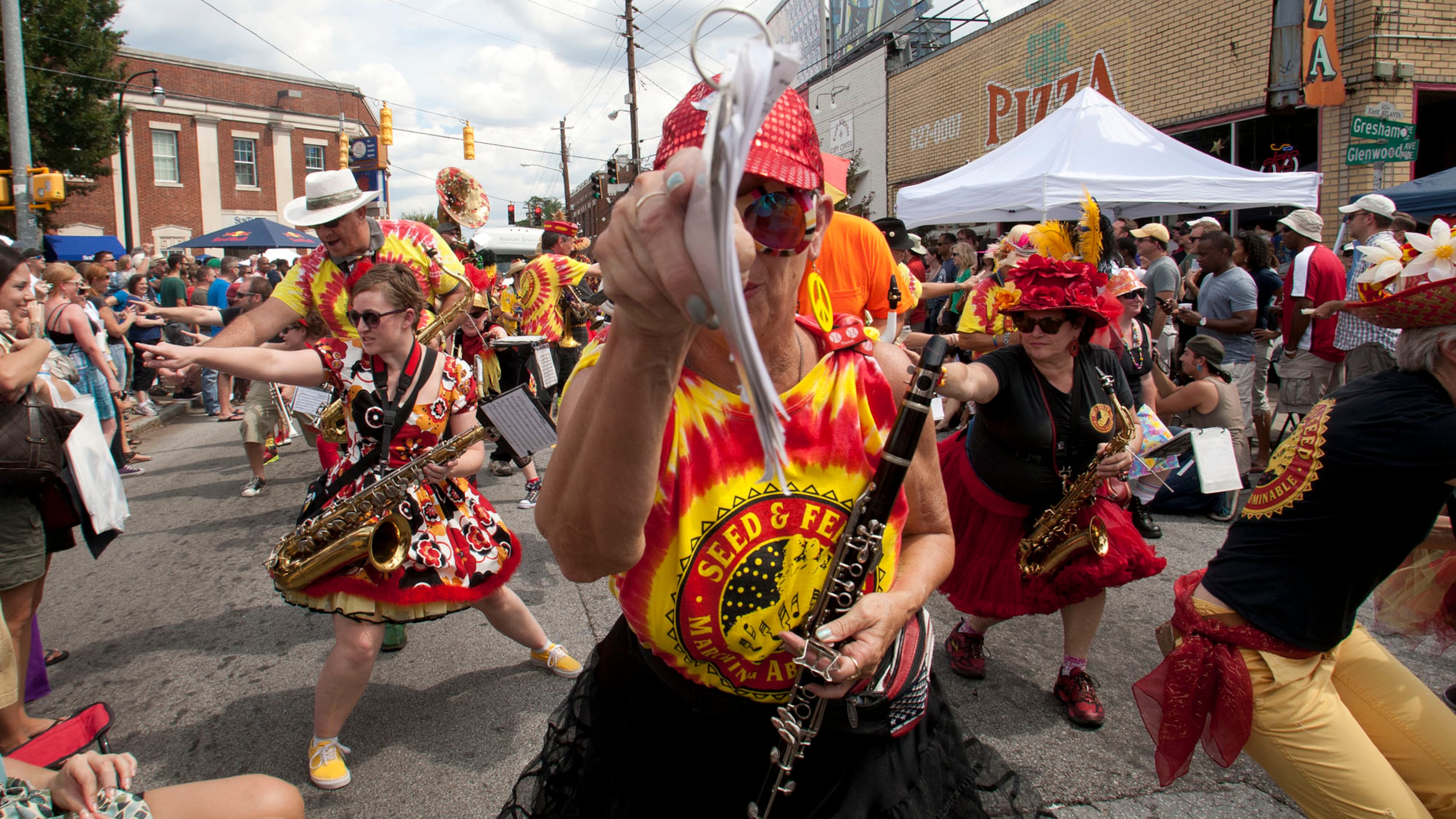 Members of the Seed & Feed Marching Abominable Band thrill the crowds lining the streets as they kick off the 2012 East Atlanta Village Strut Festival.