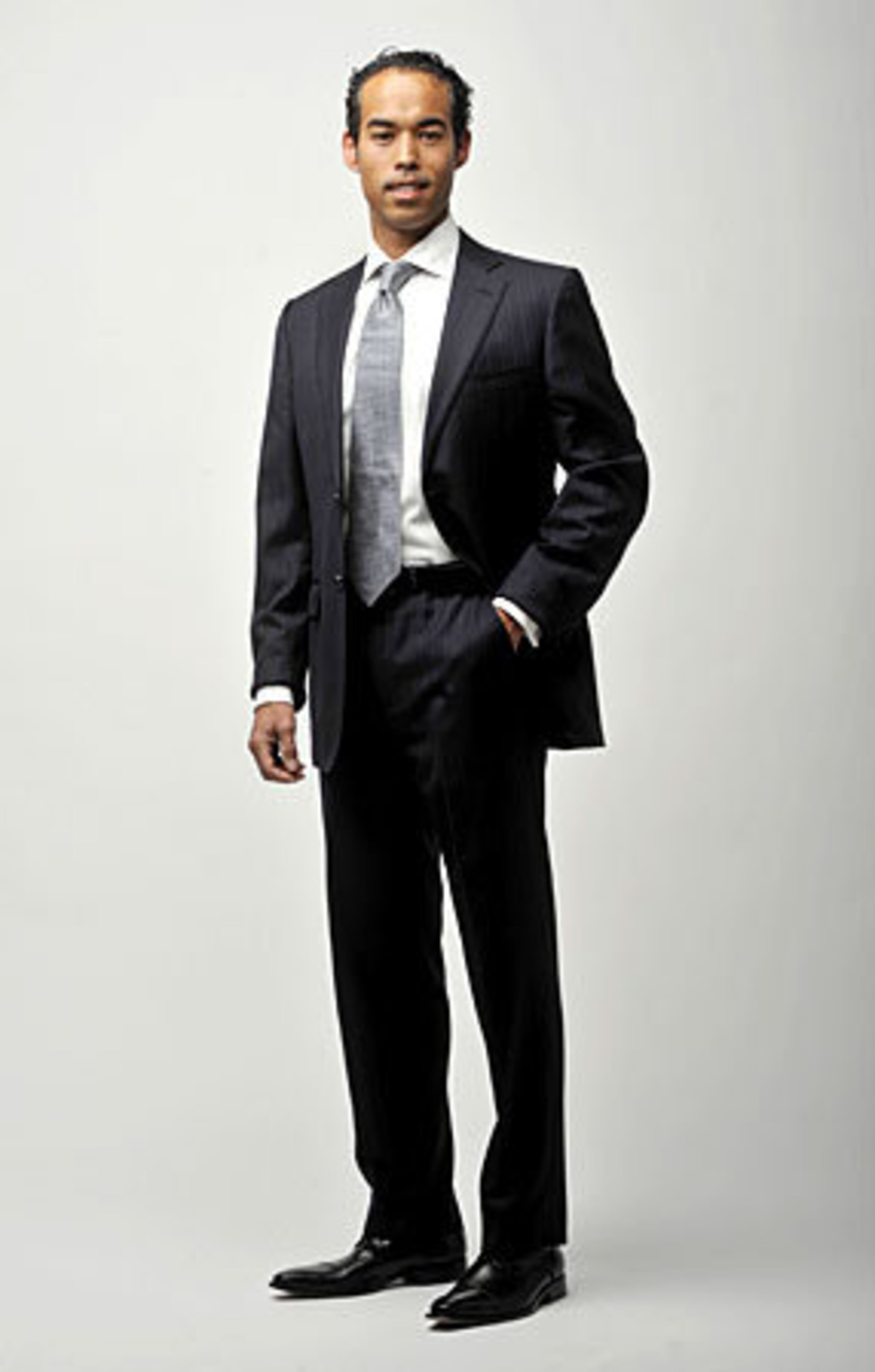 The Fix: This suit by Ermenegildo Zegna gives a more streamlined fit. To test a jacket for the correct length, stand straight with arms at your sides. The jacket should end near your knuckles. Button the jacket and give it a tug away from your body. You should have one to two inches of room - this applies even for guys with extra pounds in the stomach area. "You want to give the effect of a defined waist, " Mukoro says.