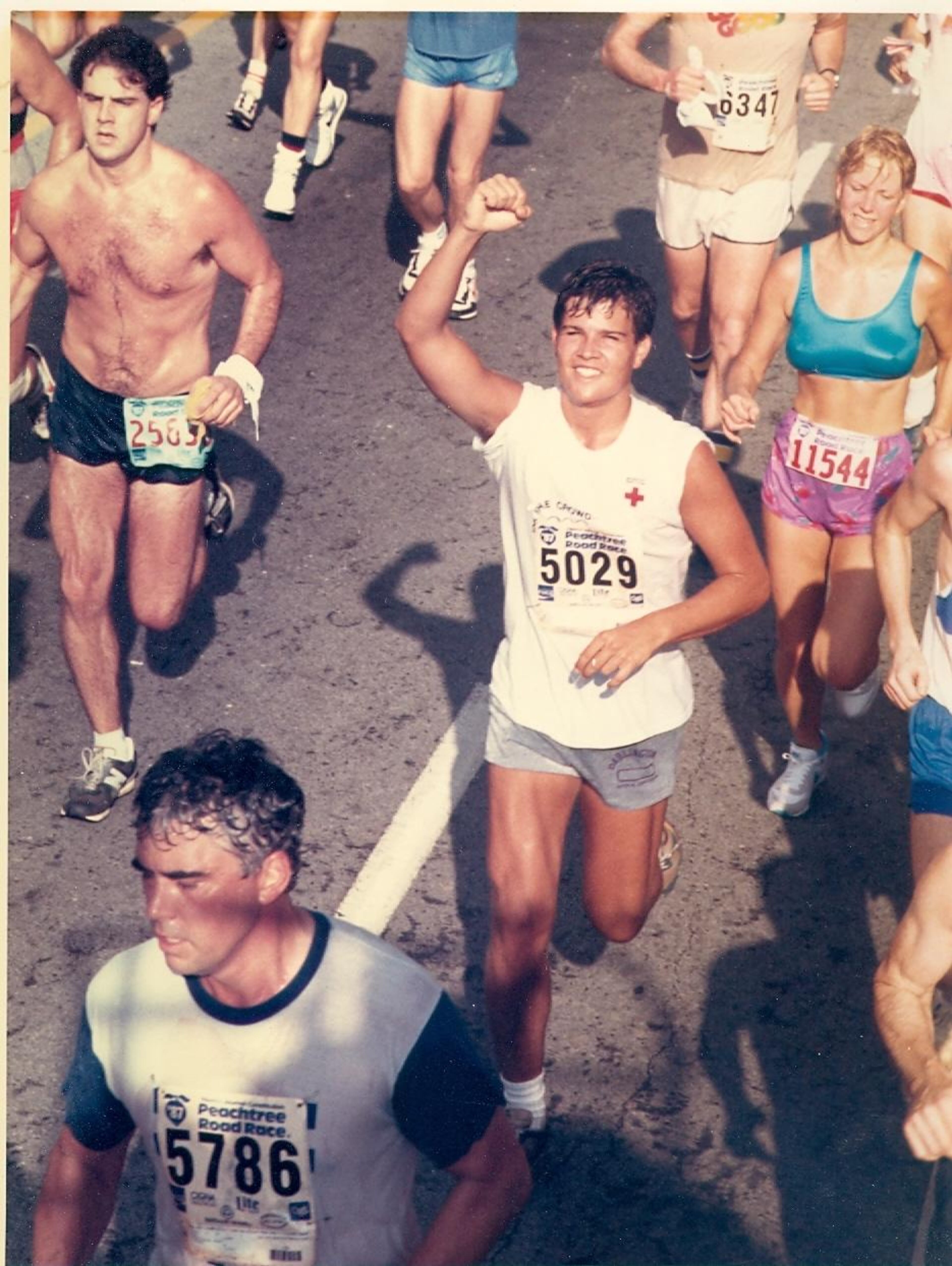 This WSB-TV anchor couldn't find a prom photo to share, but he did find an old photo from the Peachtree Road Race. Do you know who that is?