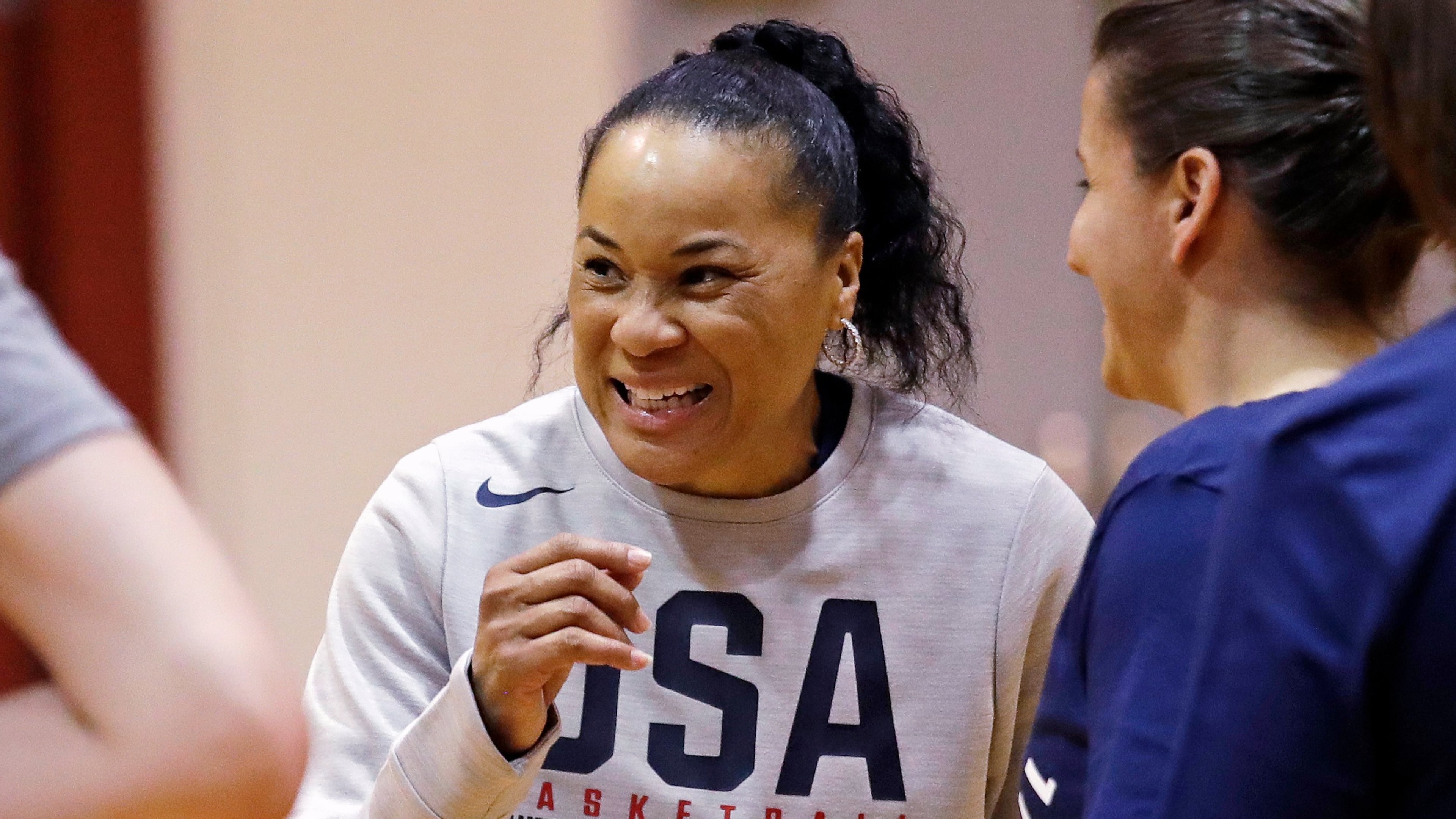 FILE - Coach Dawn Staley talks with players and assistant coaches during a practice for the U.S. women's basketball team in Seattle on April 24, 2018. (AP Photo/Elaine Thompson, File)