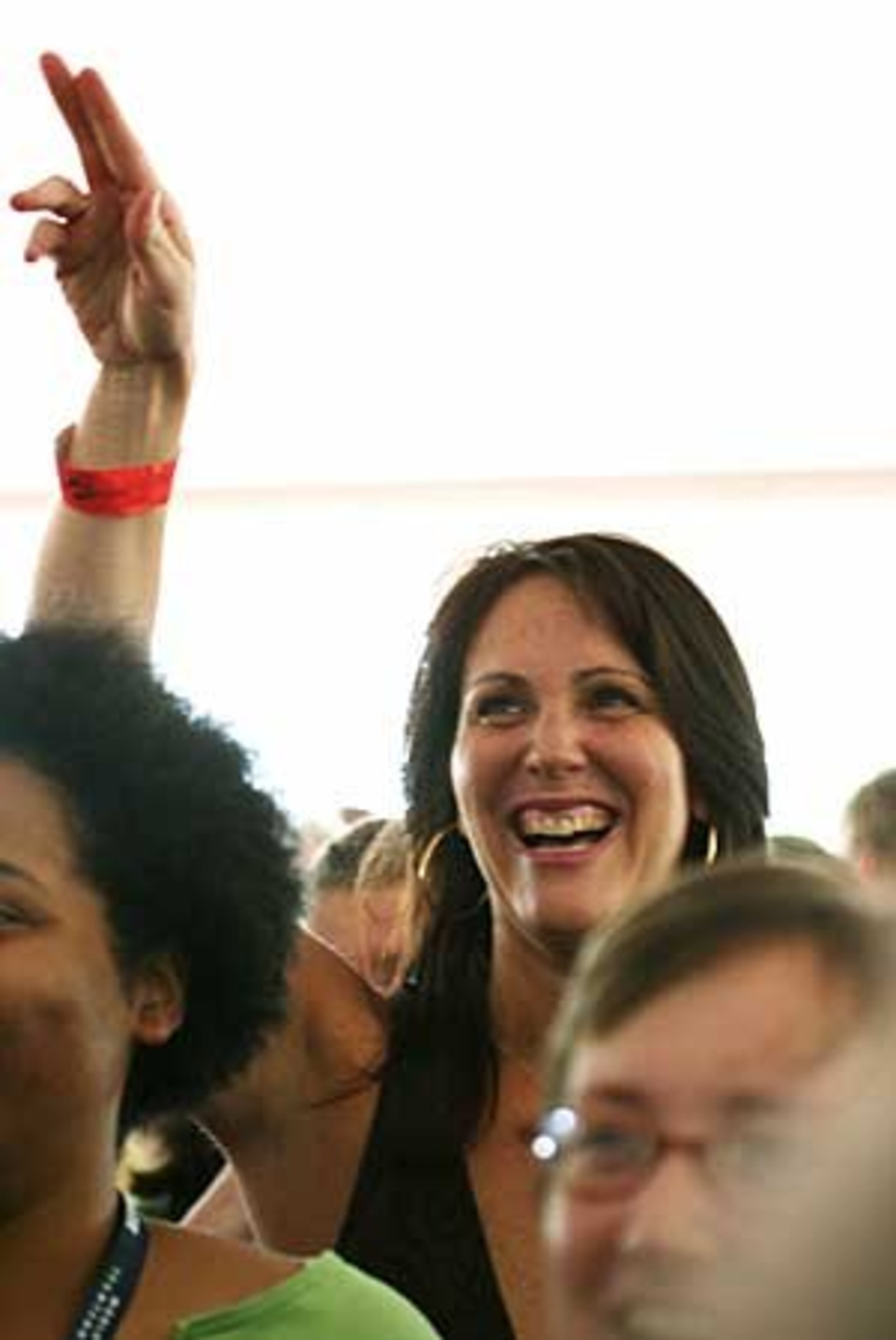 Lori Bertman of Baton Rouge, La., wins a $15,000 bid for a one-hour hitting session with tennis pro Andy Roddick at the Advanta WTT Smash Hits tennis event. Bertman made the bid after Roddick promised to give "the full monty" while conducting the hitting session.