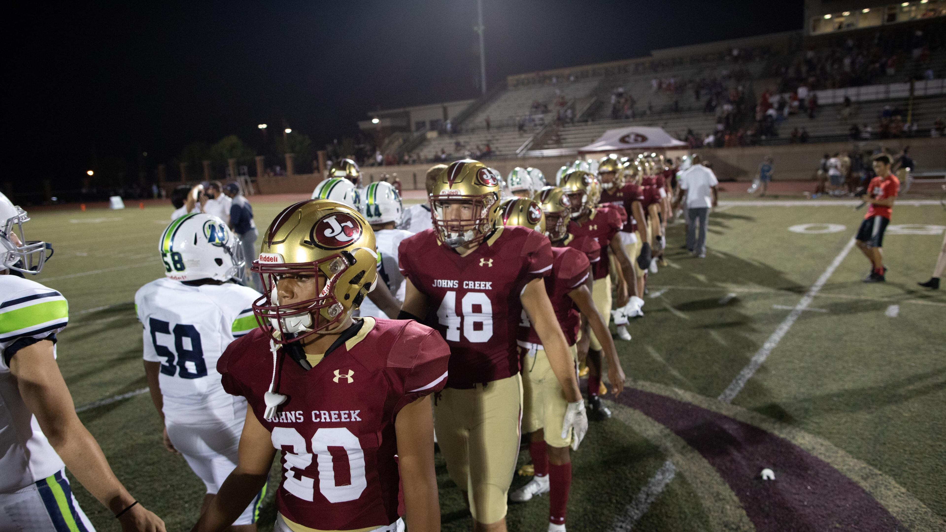 Players shake hands after Johns Creek's big win over Northview Friday. (Dustin Chambers/Special)