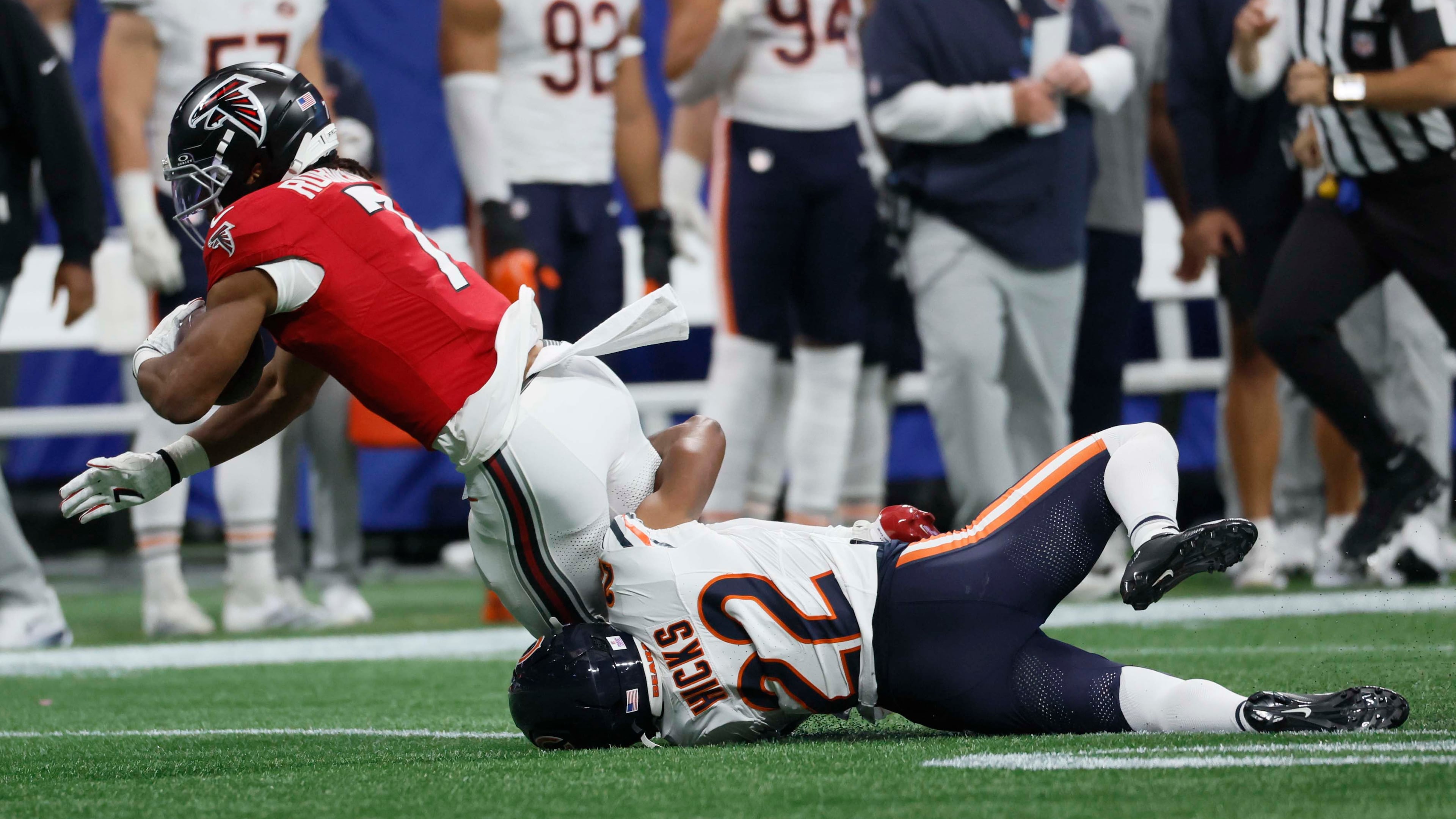 Bears safety Elijah Hicks stops Falcons tackle Bijan Robinson from from advancing during Atlanta's loss to Chicago on Sunday, Oct. 18, 2026. (Miguel Martinez/AJC)