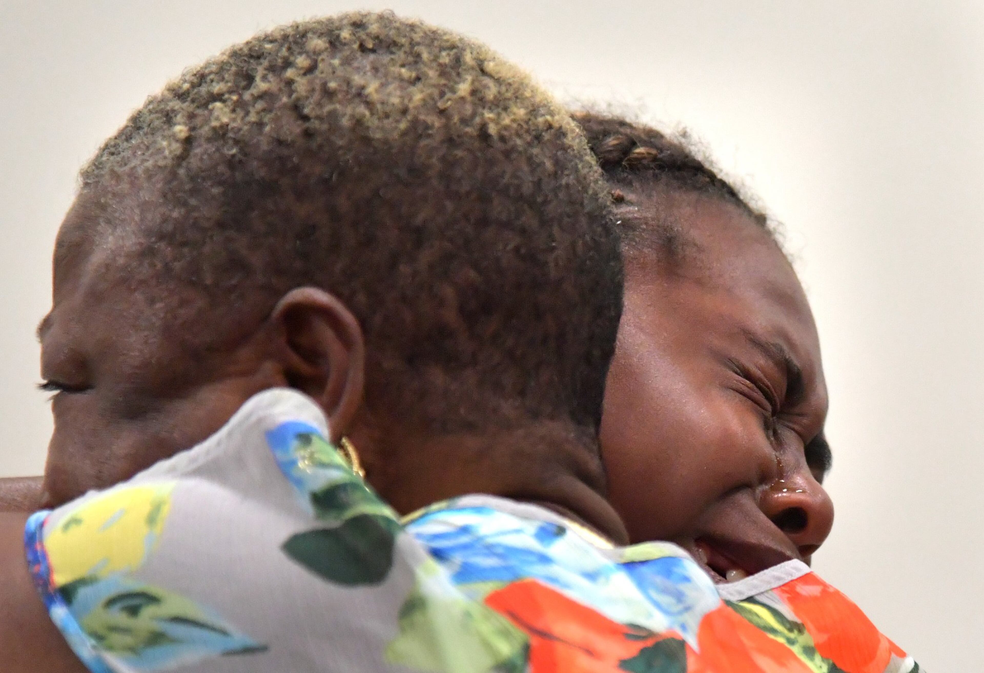 Family members of Timothy Coggins embrace after the murder trial of Franklin Gebhardt at the Spalding County Courthouse on Tuesday, June 26, 2018. A jury found the 60-year-old defendant - labeled a racist by his own lawyer - guilty on all counts for the 1983 crime. Gebhardt was charged with killing 23-year-old Timothy Coggins, stabbing him 30 times and dragging his body behind a pickup truck.